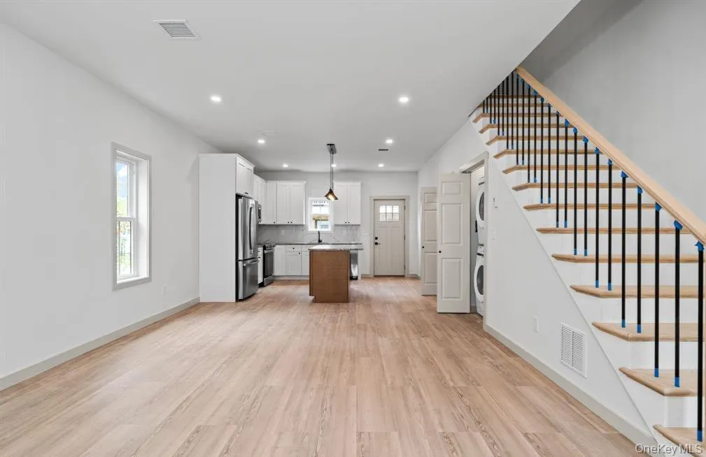 Open floor plan flows nicely from the living room into the modern kitchen. Open floor plan flows nicely from the living room into the modern kitchen.