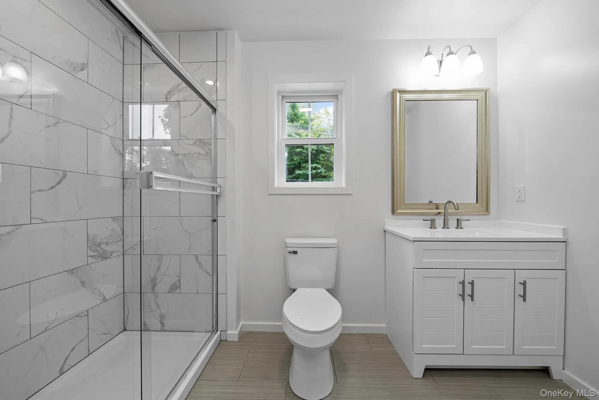 Second level full bath with step in shower. Second level full bath with step in shower.