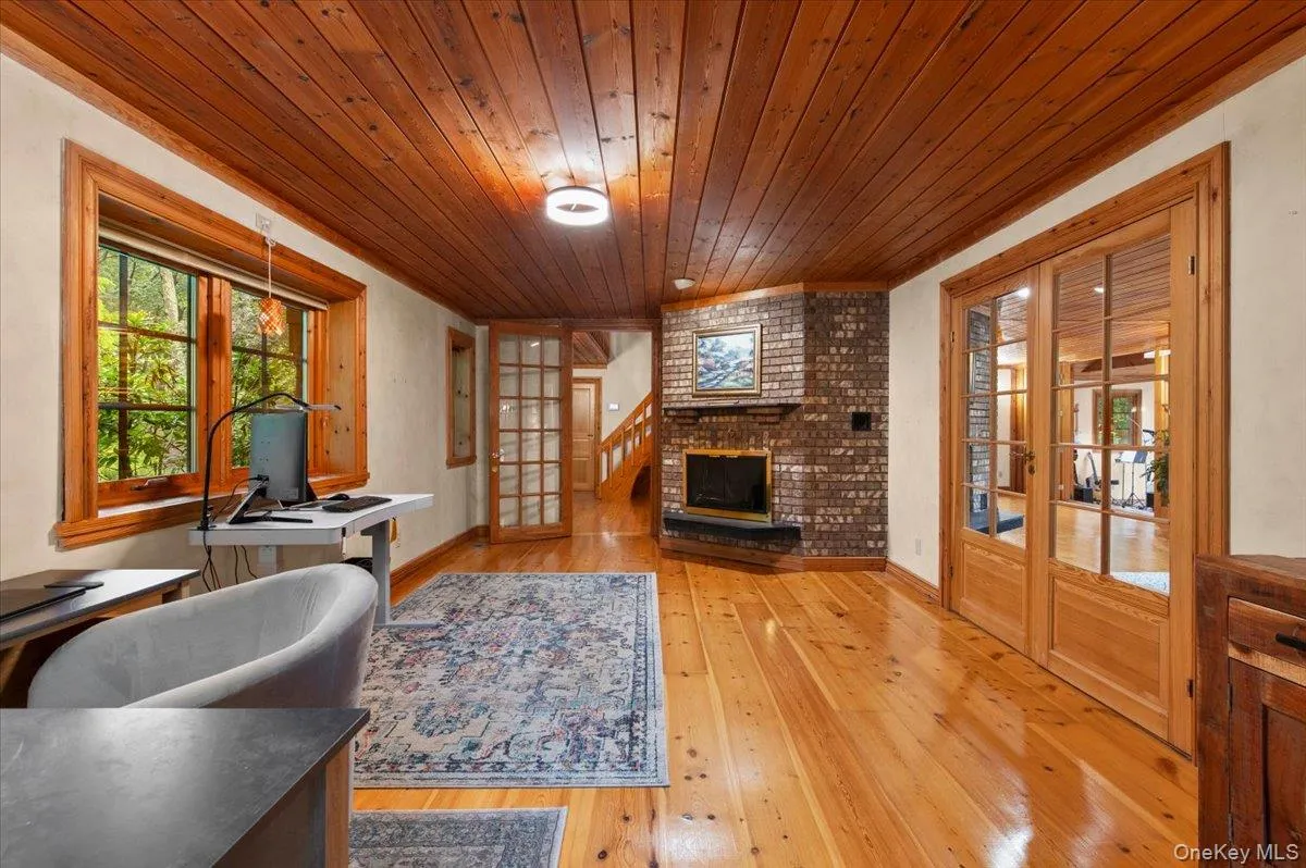 Designated office or flex space with its own wood burning fireplace. Designated office or flex space with its own wood burning fireplace.