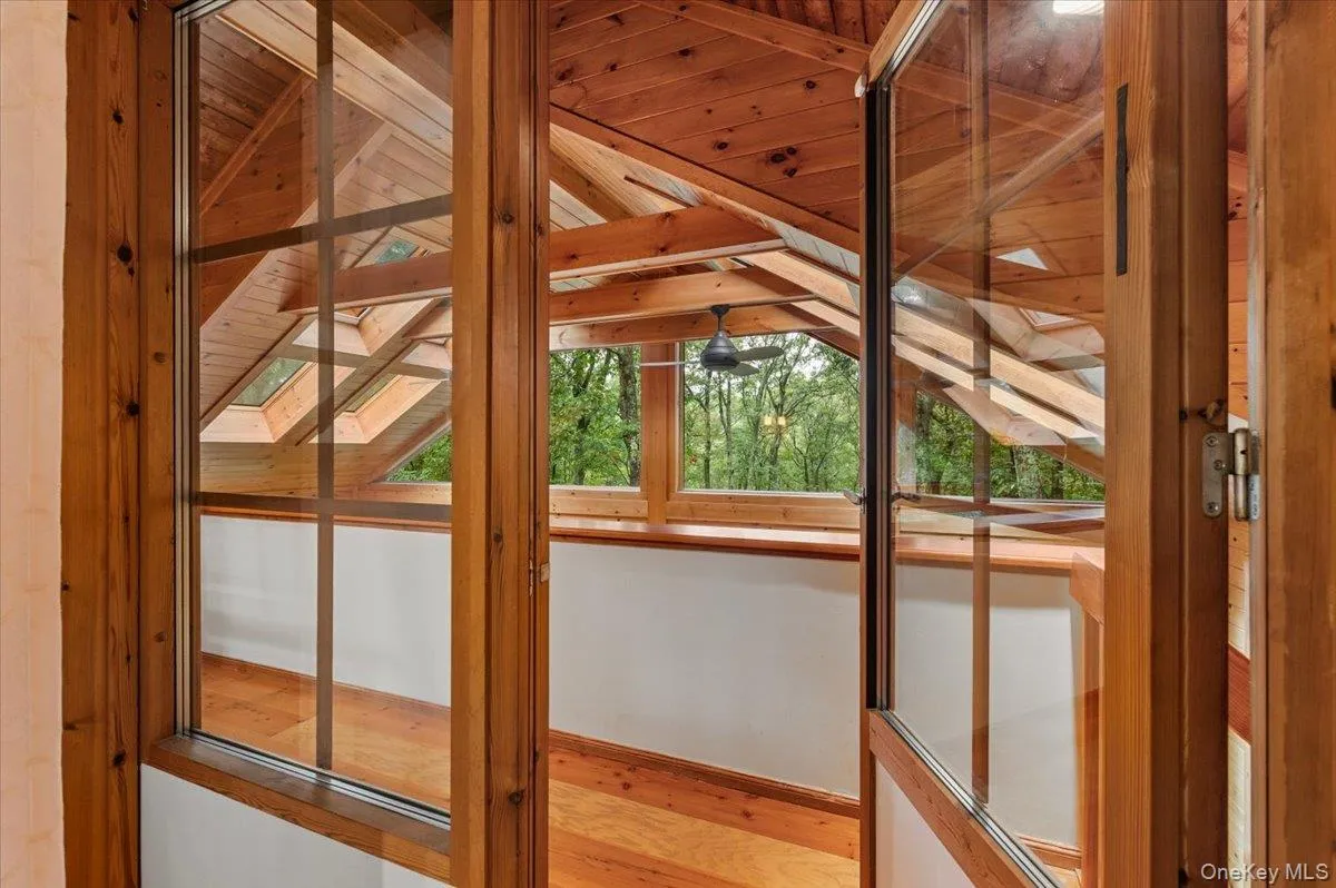 Entry to balcony that overlooks the sunroom. Entry to balcony that overlooks the sunroom.