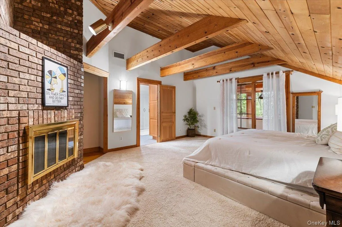 Large yet cozy primary bedroom with its own fireplace. Large yet cozy primary bedroom with its own fireplace.