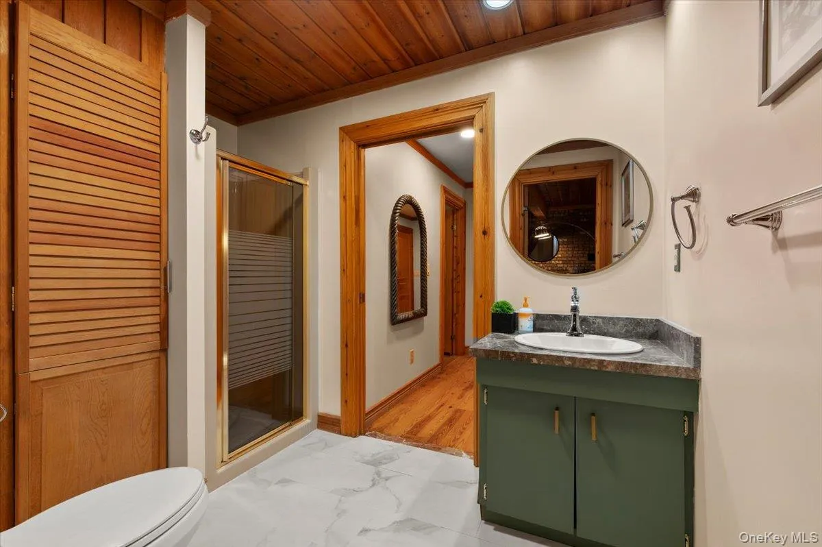 First floor full bath with updated vanity, toilet and plumbing fixtures. First floor full bath with updated vanity, toilet and plumbing fixtures.