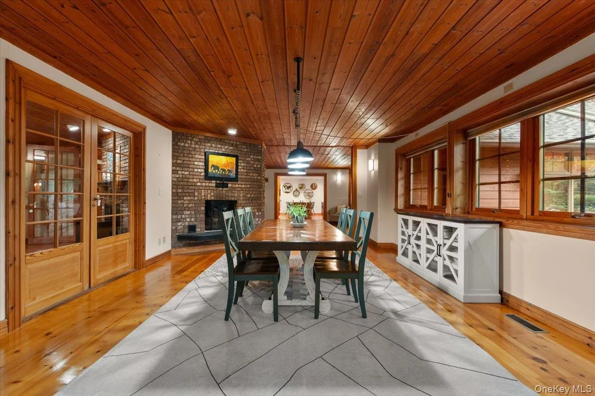 French doors open to office. View toward kitchen. French doors open to office. View toward kitchen.