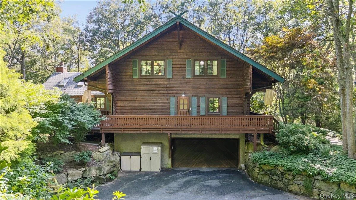 Two car garage with electric car charging port. Two car garage with electric car charging port.