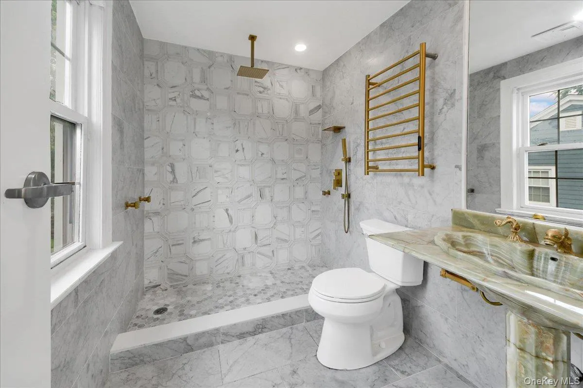 Upated Primary bathroom with tiled carrera Mable Upated Primary bathroom with tiled carrera Mable