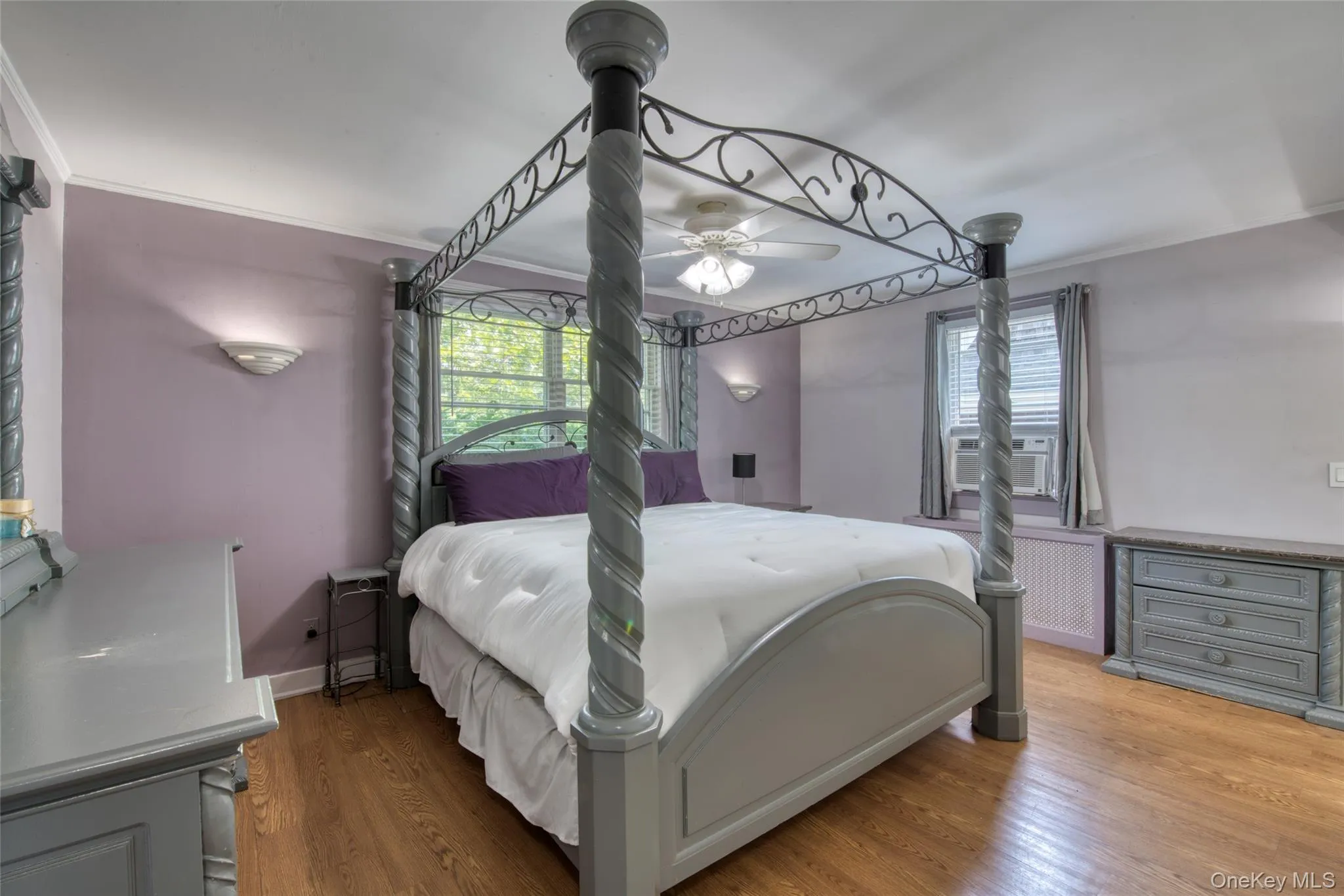 Primary Bedroom with hardwood floors & fireplace Primary Bedroom with hardwood floors & fireplace