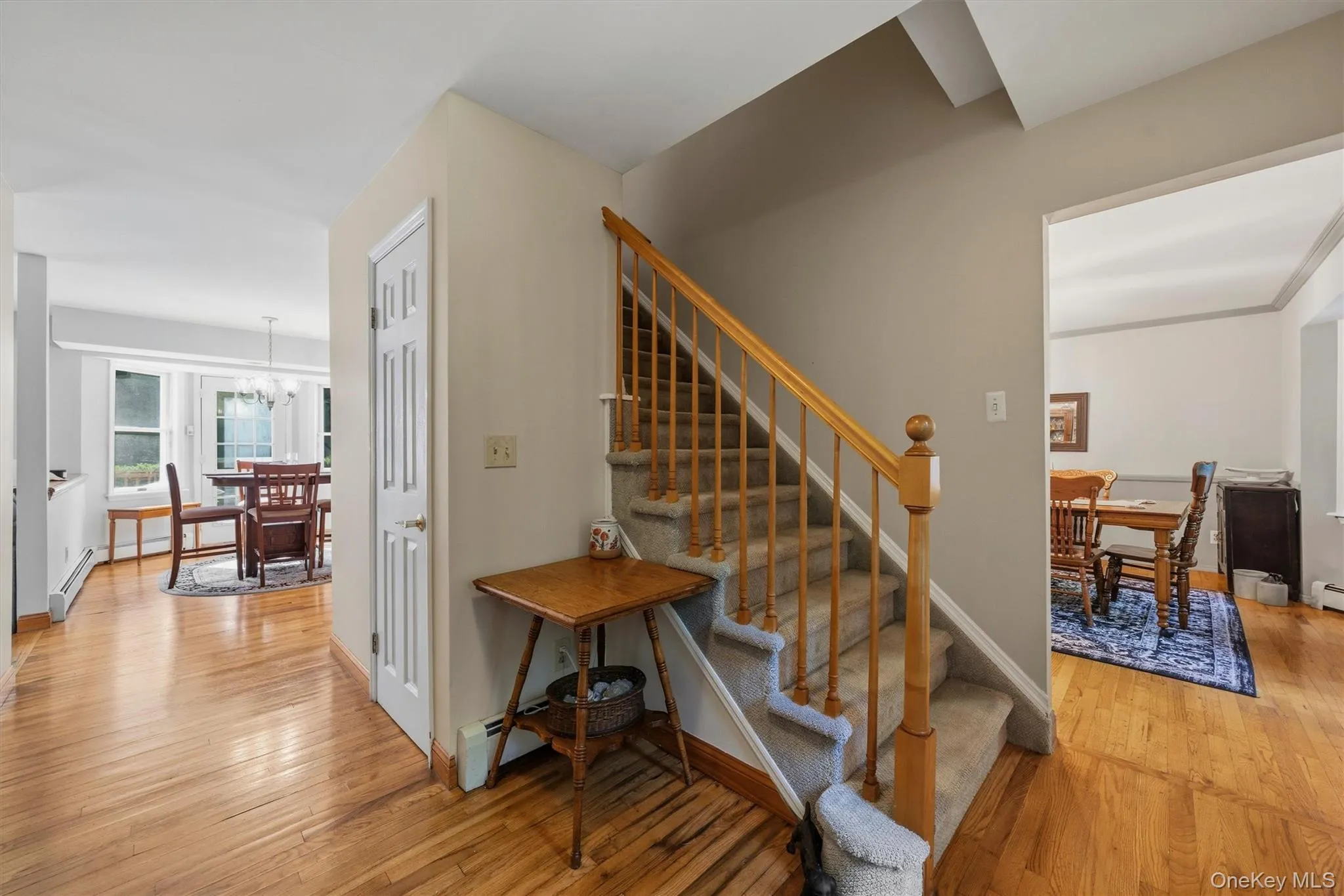 Staircase with carpeted treads and wood banister Staircase with carpeted treads and wood banister