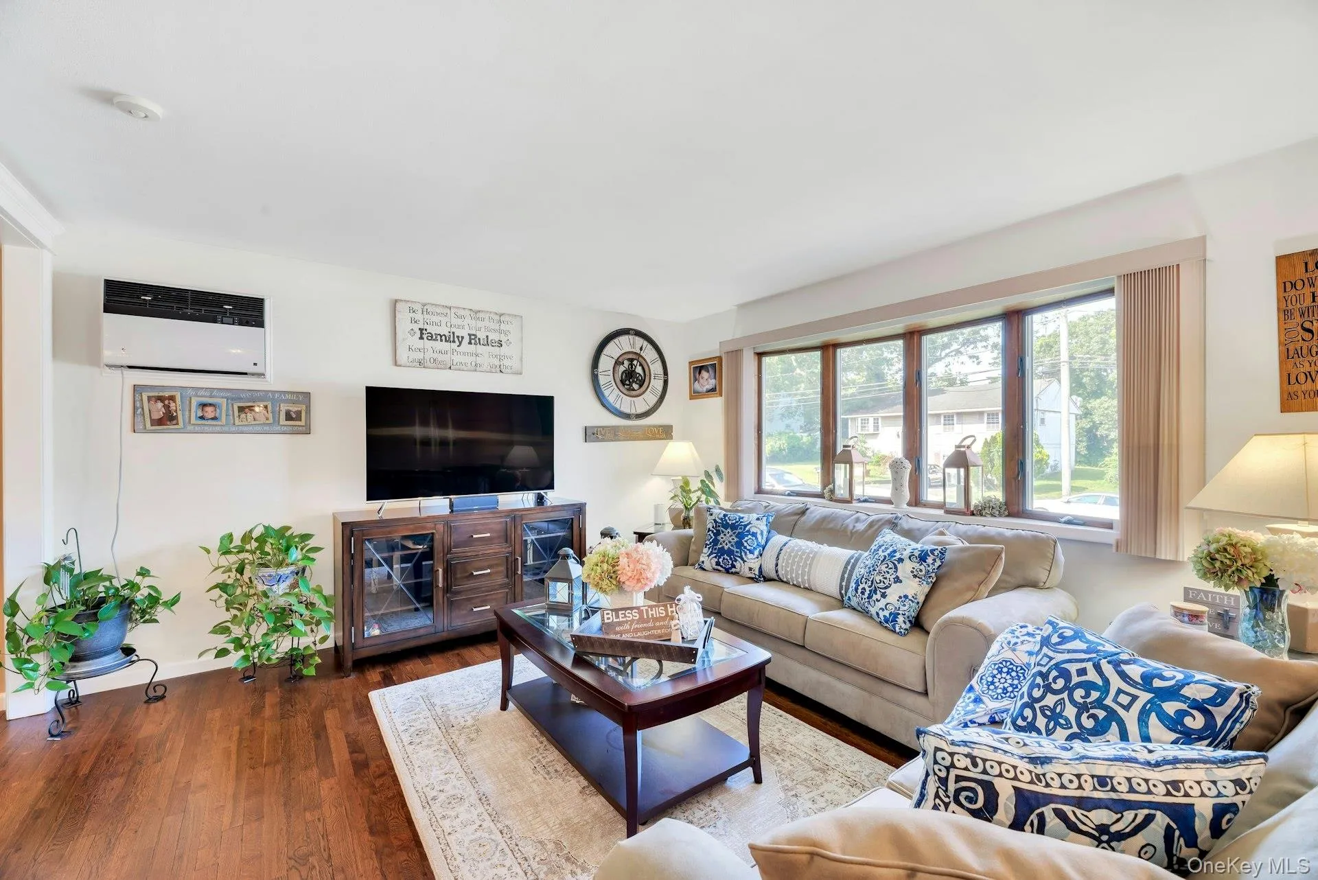 Spacious Living room with Hardwood flooring, large multi-pane bay window offering natural light Spacious Living room with Hardwood flooring, large multi-pane bay window offering natural light