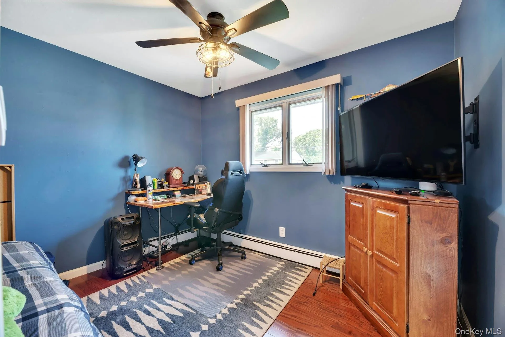 Guest bedroom currently used as an office space. Guest bedroom currently used as an office space.