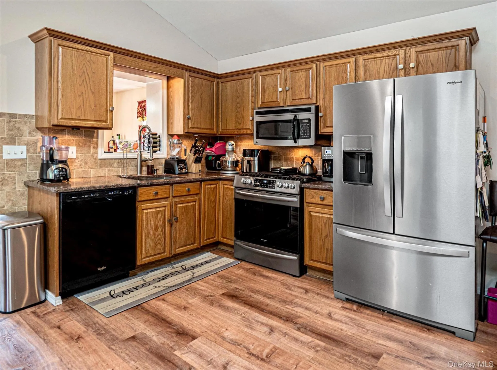 Well laid out kitchen with SS appliances & tile backsplash Well laid out kitchen with SS appliances & tile backsplash
