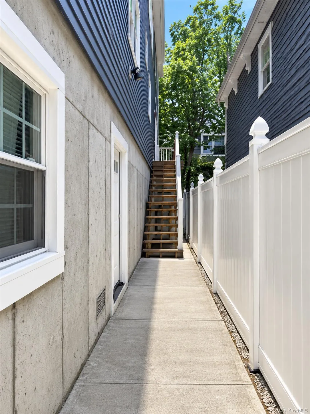 Outside stairs up to the unit on the right side of the home Outside stairs up to the unit on the right side of the home