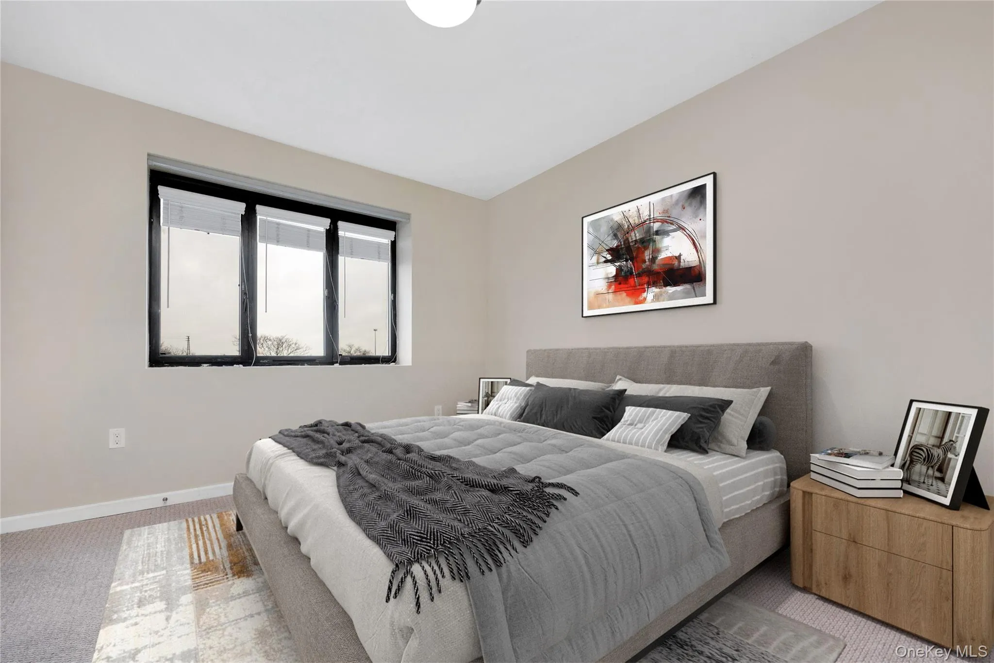Bedroom with baseboards and light colored carpet Bedroom with baseboards and light colored carpet