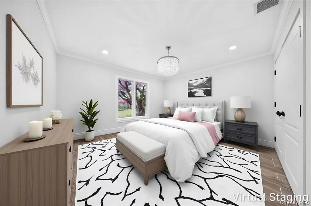 Recessed lighting, crown molding, wood-finish flooring, crystal chandelier, and paneled interior doors Recessed lighting, crown molding, wood-finish flooring, crystal chandelier, and paneled interior doors
