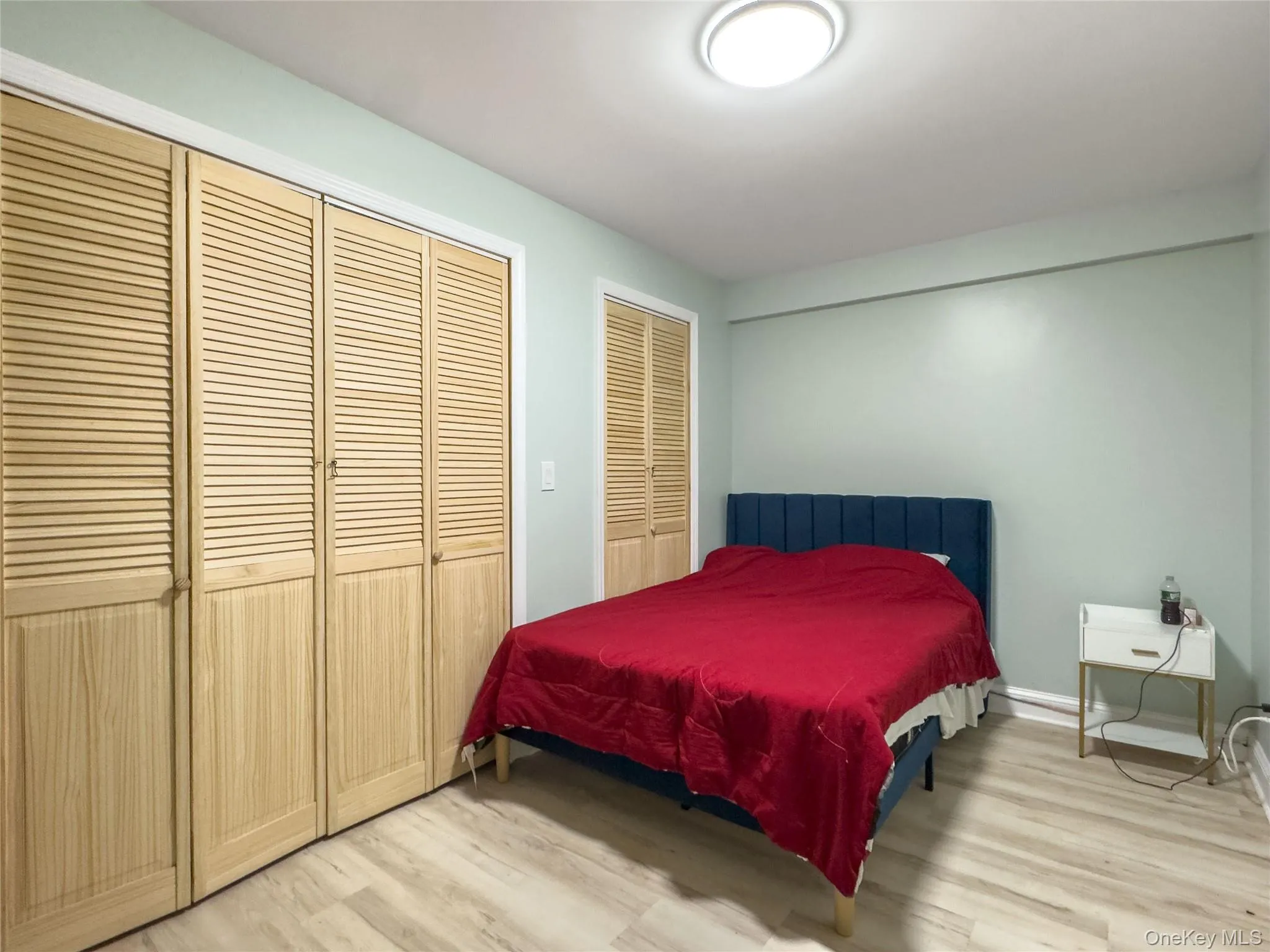Light-toned wood-finish flooring complements the room's color palette Light-toned wood-finish flooring complements the room's color palette