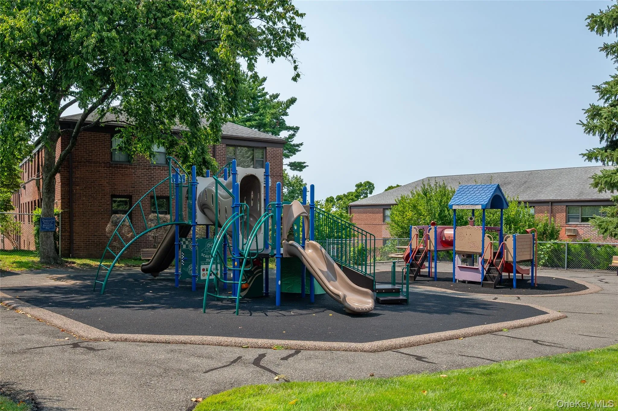 The playground is located around the back The playground is located around the back