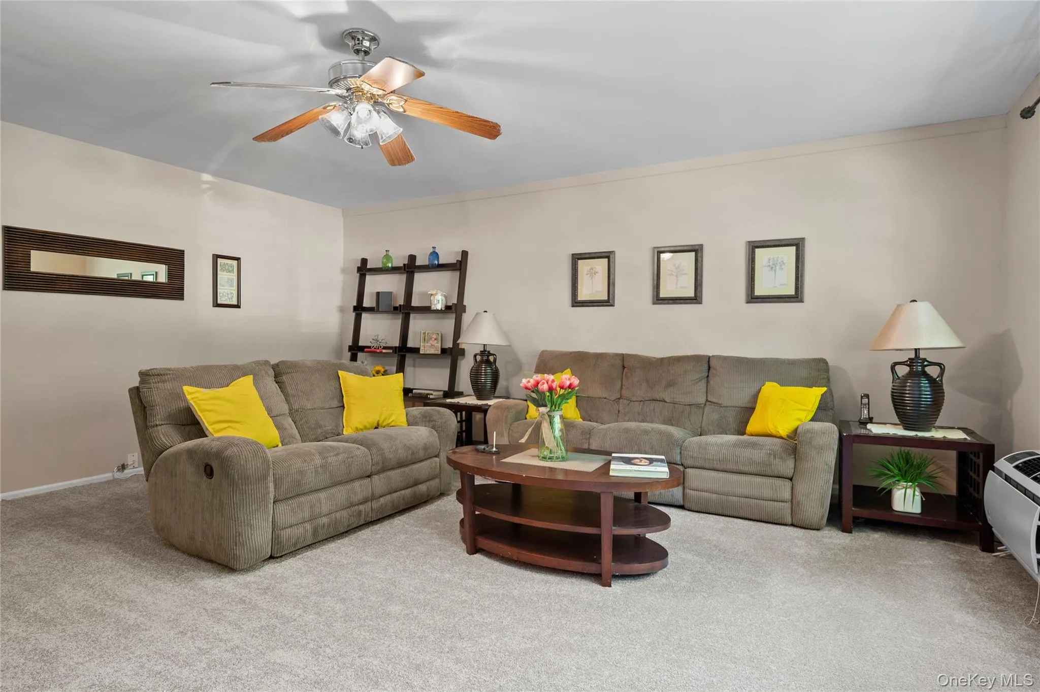 Spacious living room with new carpeting Spacious living room with new carpeting
