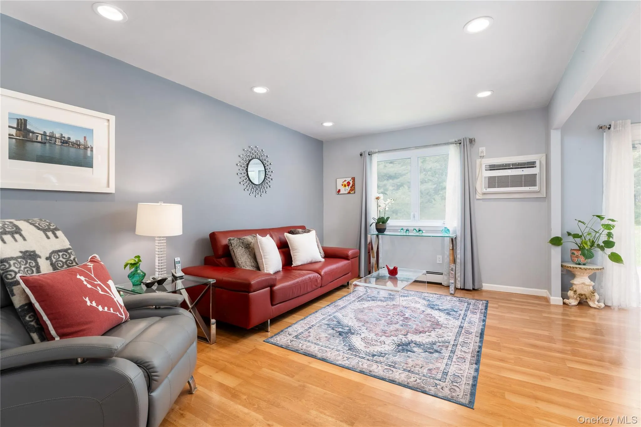 New wall AC unit, overhead light, laminate wood look flooring New wall AC unit, overhead light, laminate wood look flooring