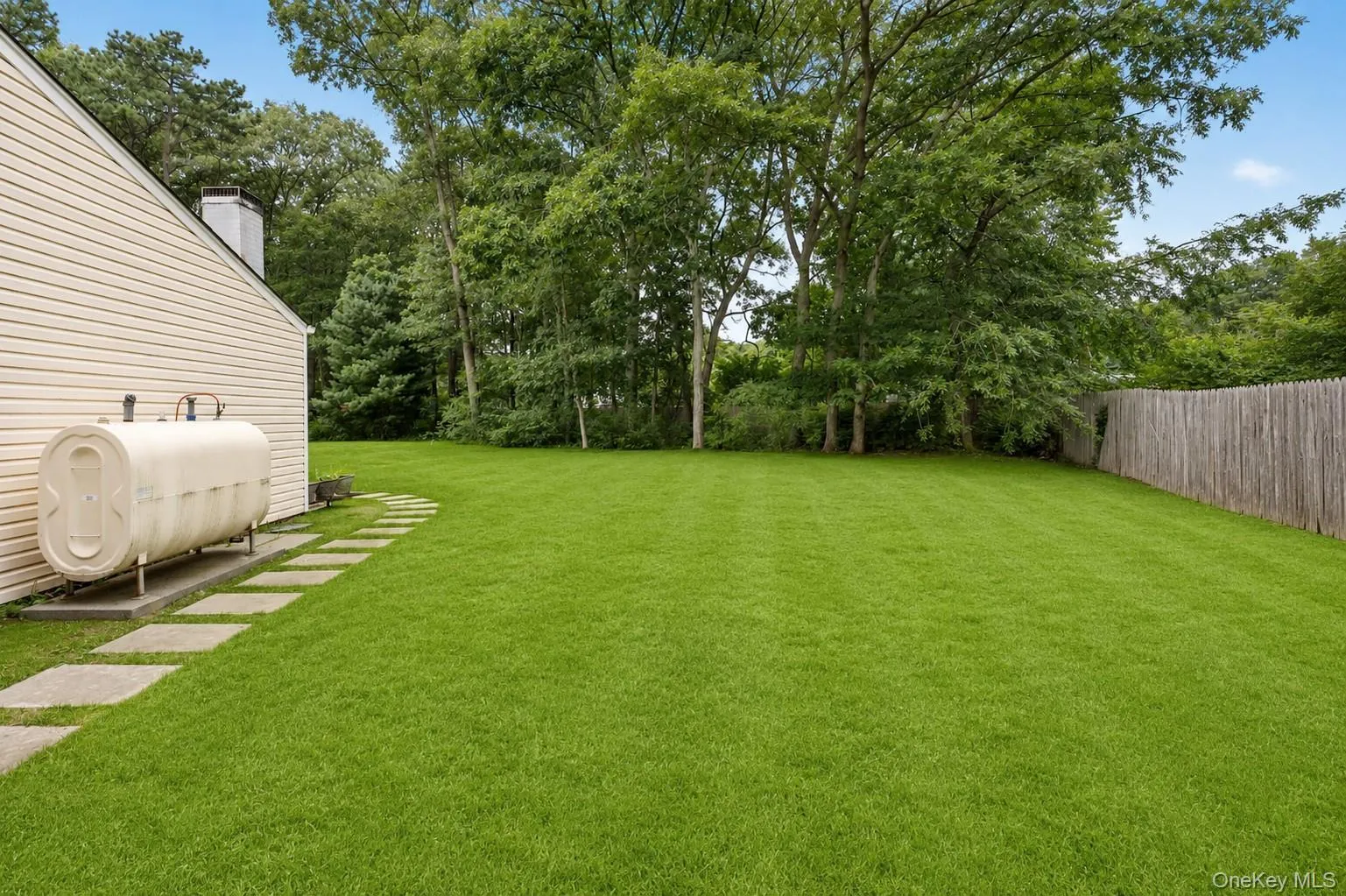 Above ground exterior oil tank replaced 5 years ago. Digitally enhanced grass Above ground exterior oil tank replaced 5 years ago. Digitally enhanced grass