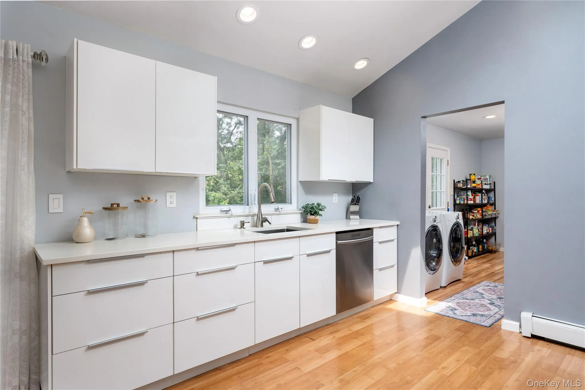 White remodeled kitchen with ample storage and counter space White remodeled kitchen with ample storage and counter space