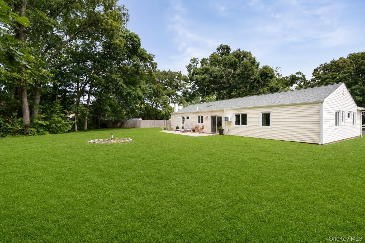 0.56-acre flat property with patio - digitally enhanced grass 0.56-acre flat property with patio - digitally enhanced grass