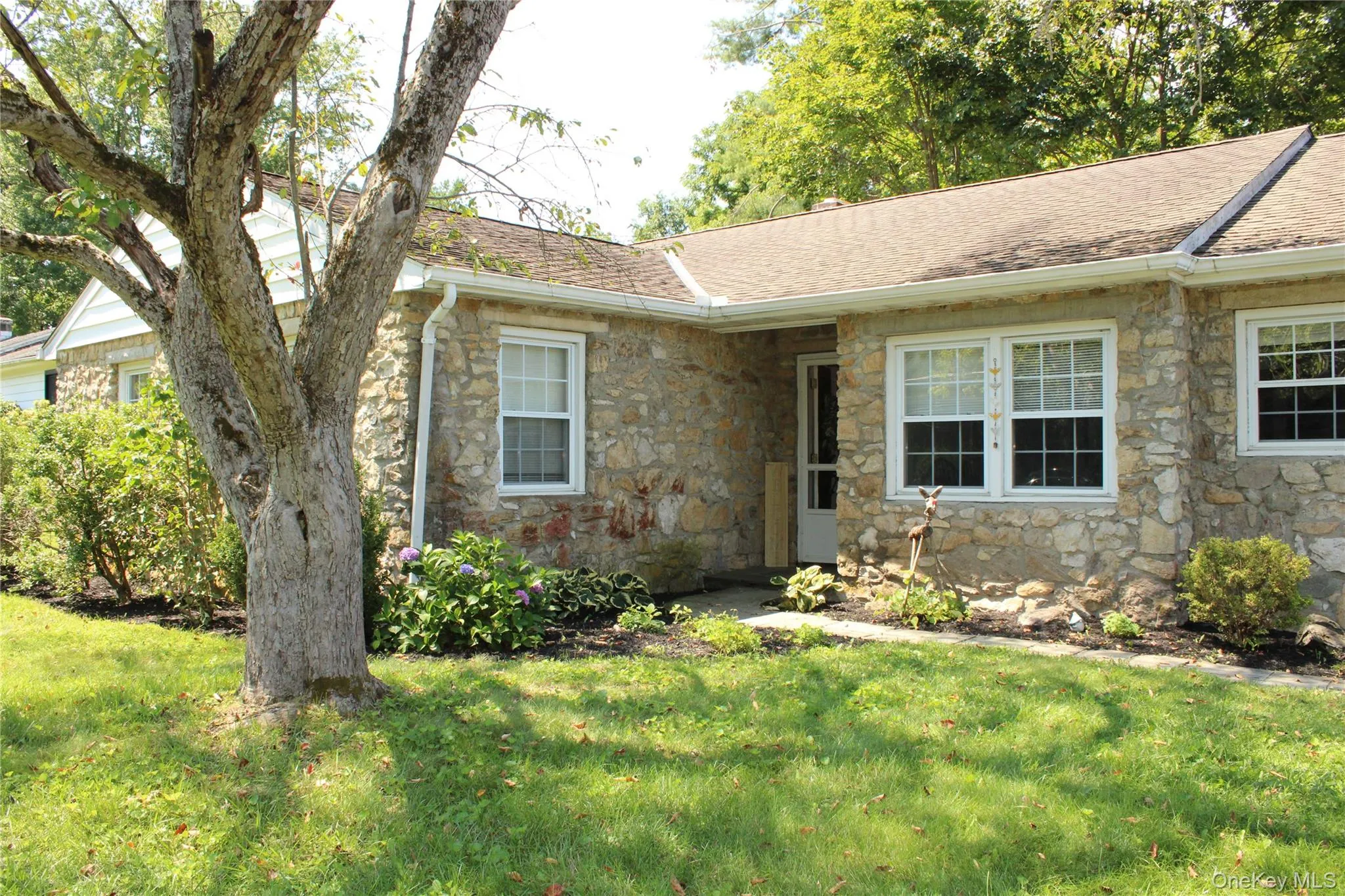 Curb appeal with stone exterior and landscaping Curb appeal with stone exterior and landscaping