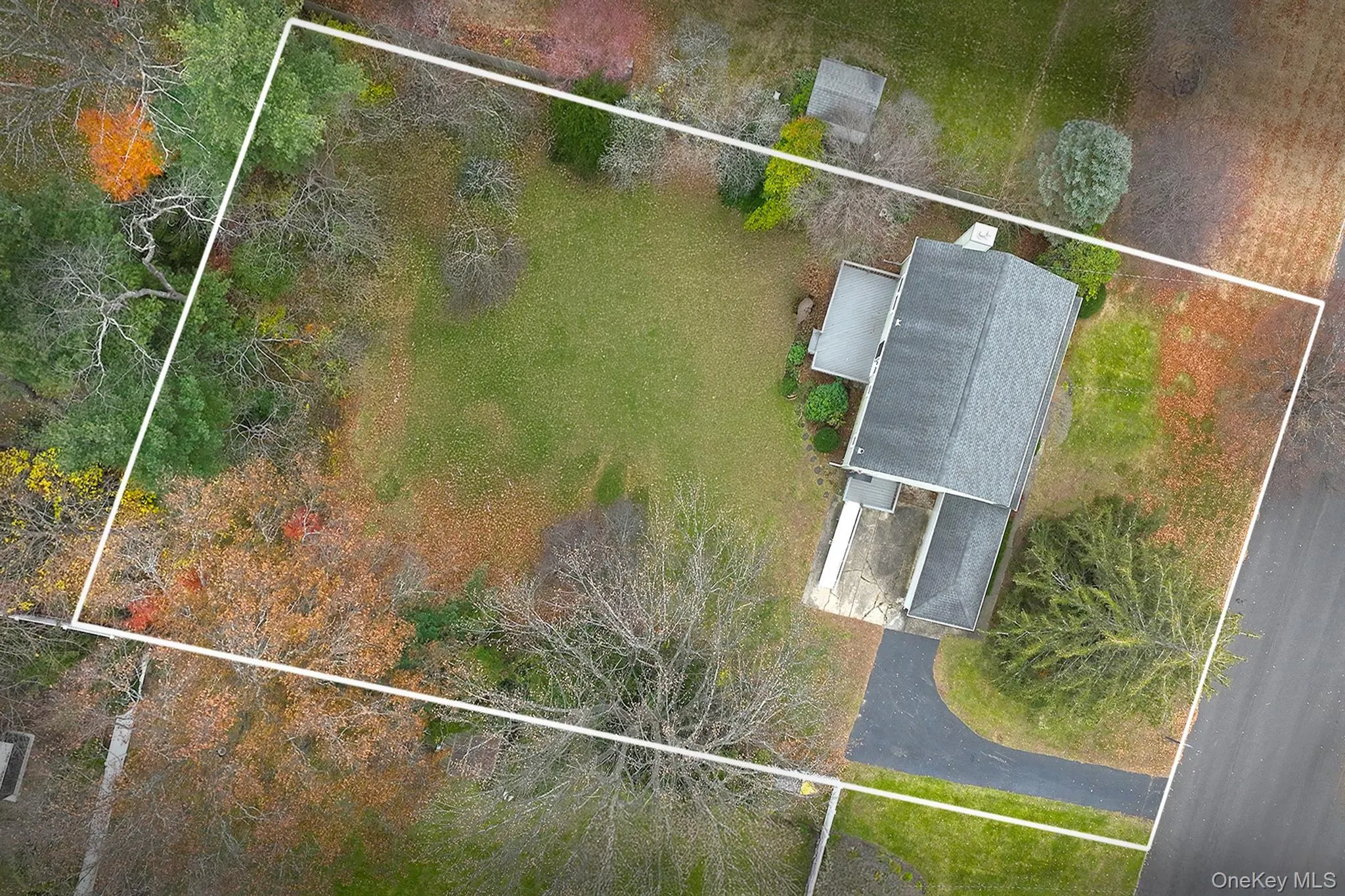Aerial view of property and surrounding area with property parcel outlined Aerial view of property and surrounding area with property parcel outlined
