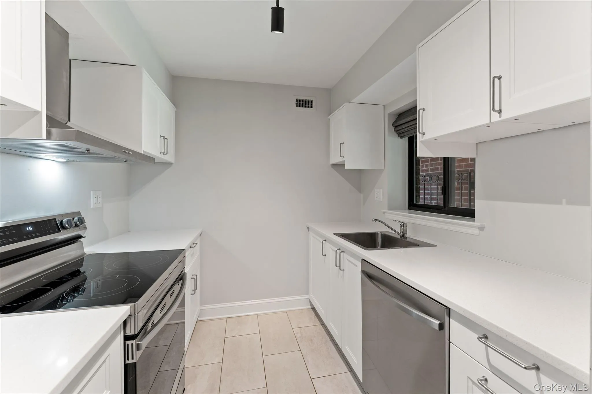 Kitchen view featuring stainless steel appliances. Kitchen view featuring stainless steel appliances.