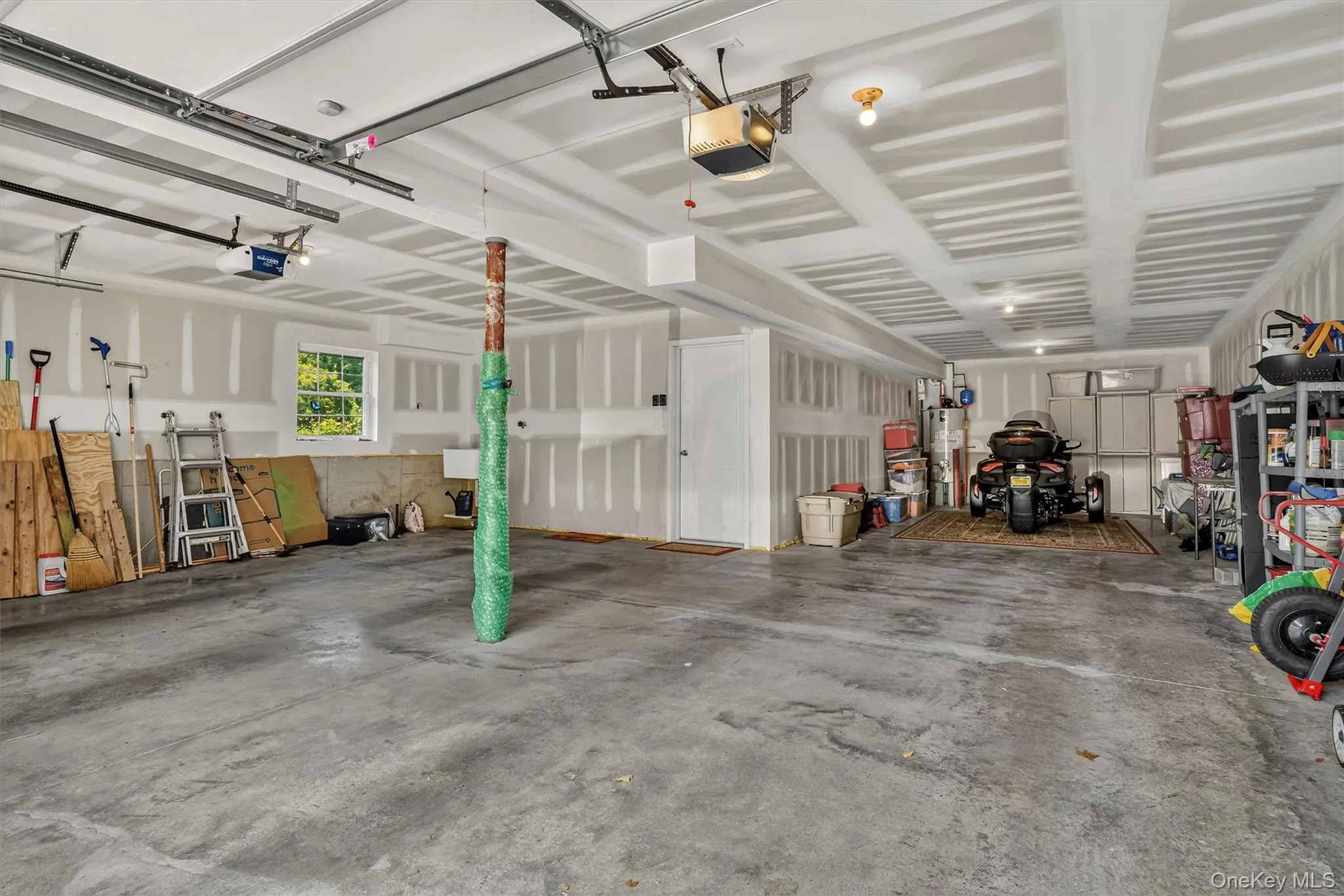 2-Bay Garage with 3-Car Capacity and Remote Garage Door Openers. 2-Bay Garage with 3-Car Capacity and Remote Garage Door Openers.