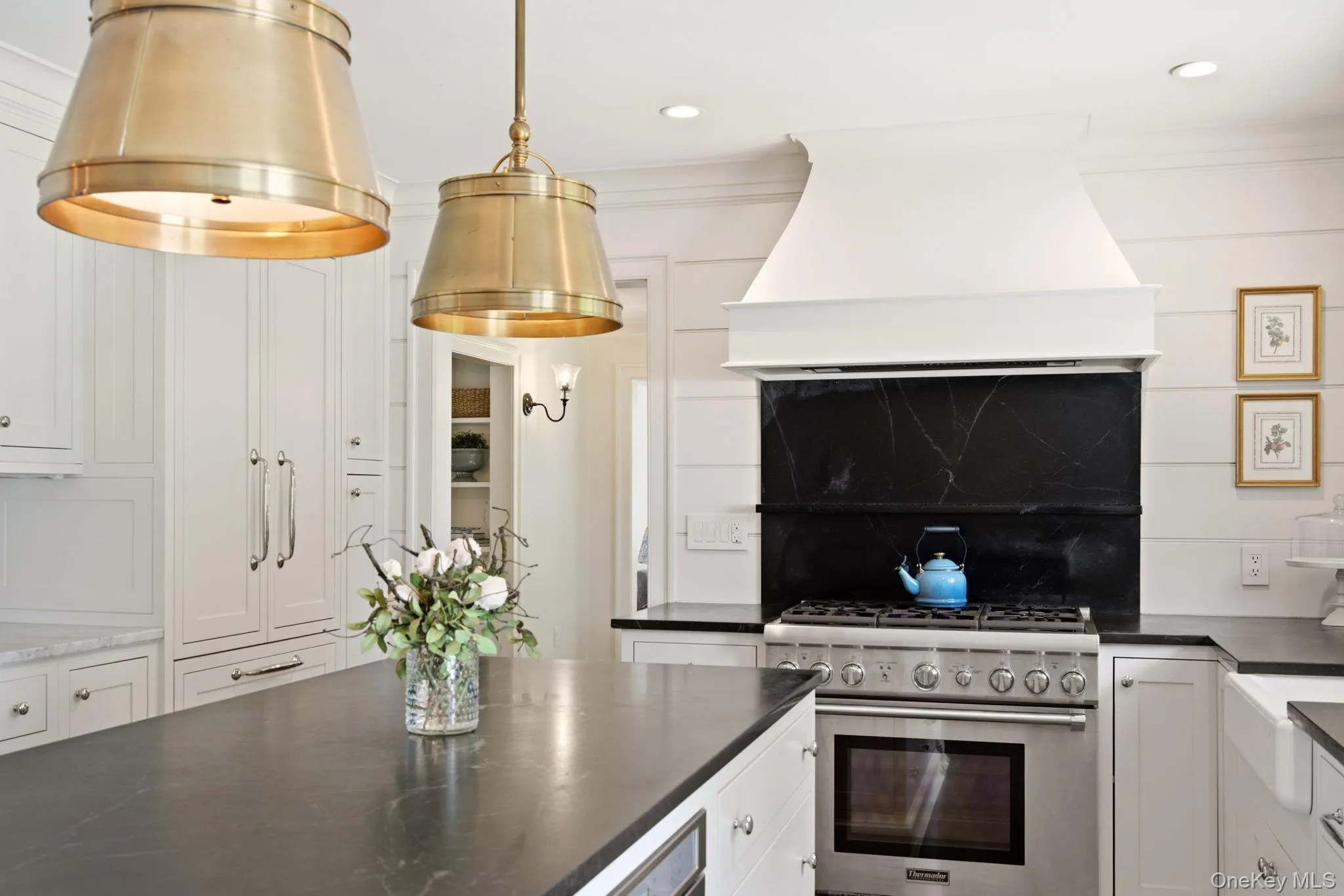 Thermador gas range with custom range hood. Thermador gas range with custom range hood.