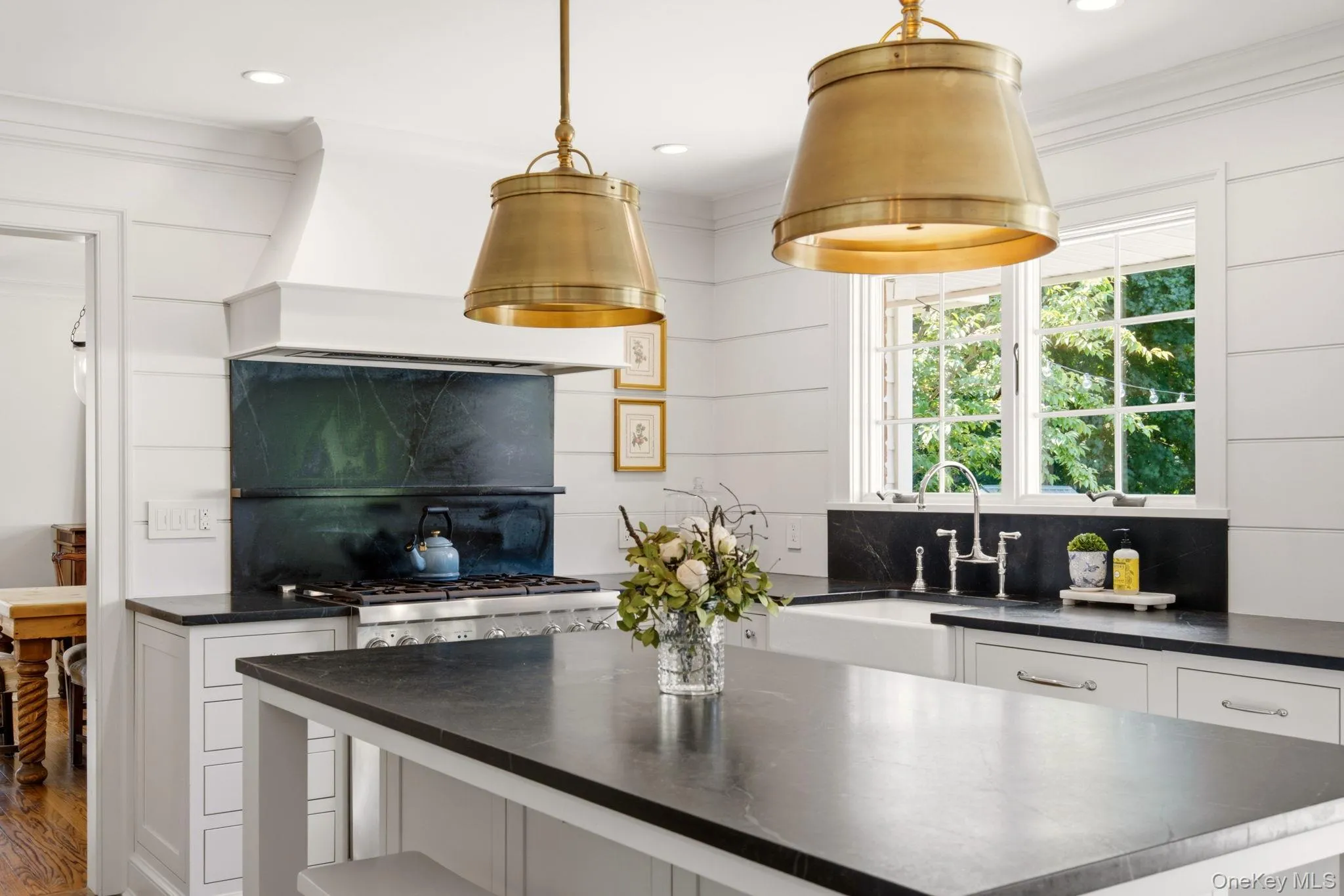 Kitchen windows with views of the yard. Kitchen windows with views of the yard.