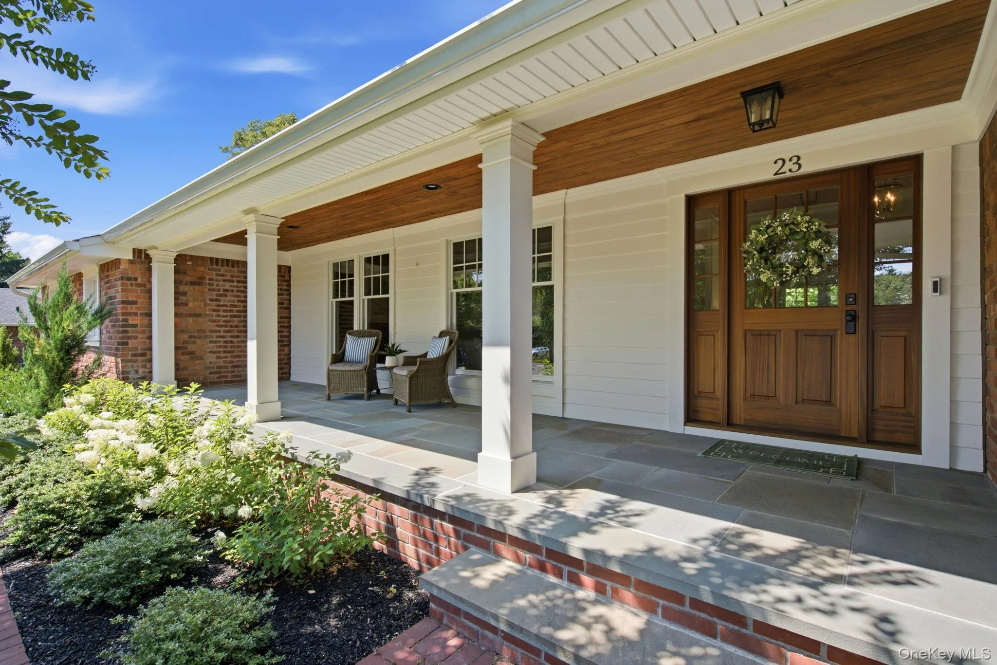 Newly Renovated Covered Front Porch with Blue Stone & Mahogony Front Door . Newly Renovated Covered Front Porch with Blue Stone & Mahogony Front Door .