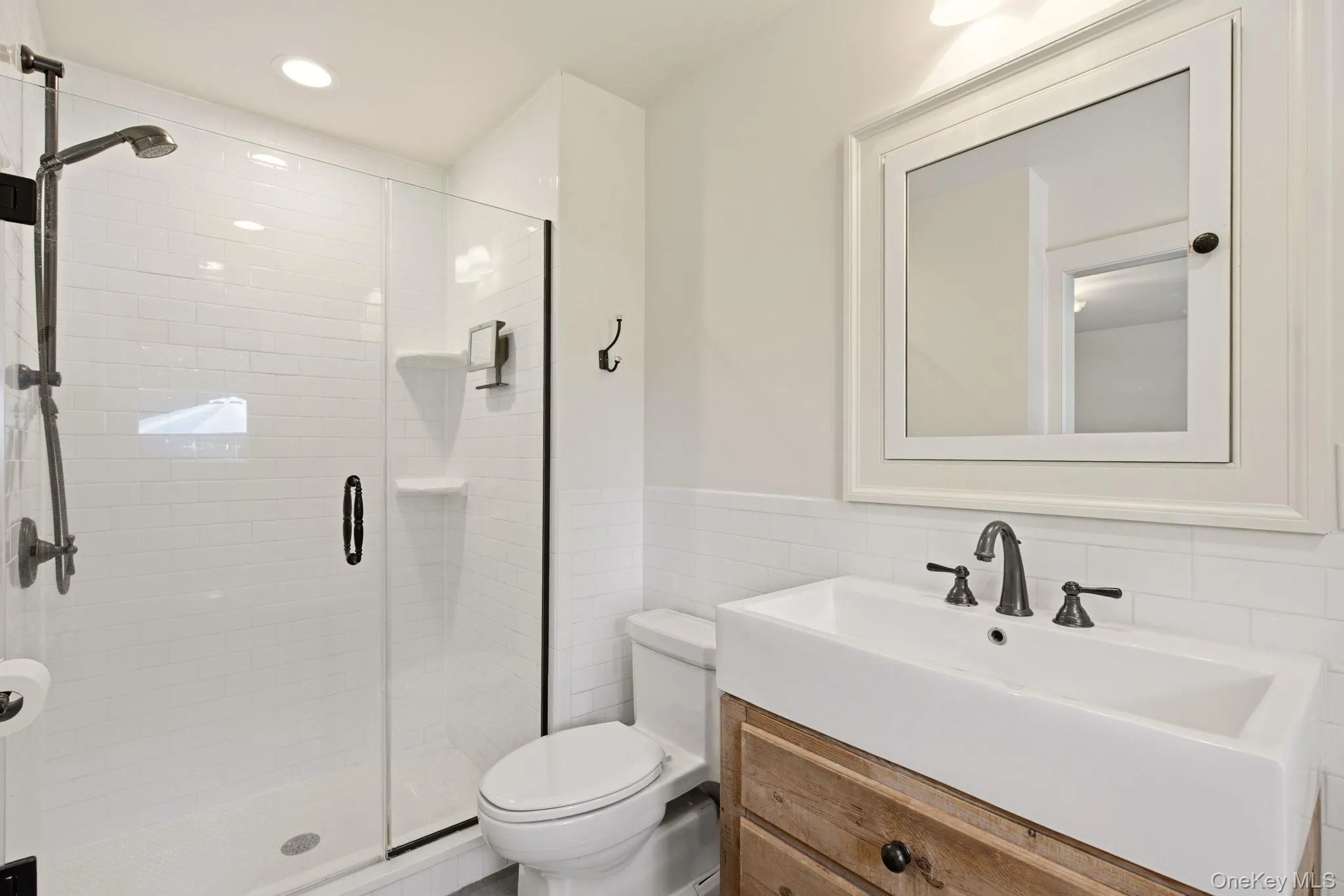 Classically Updated Bathroom with shower and farm-style vanity. Classically Updated Bathroom with shower and farm-style vanity.