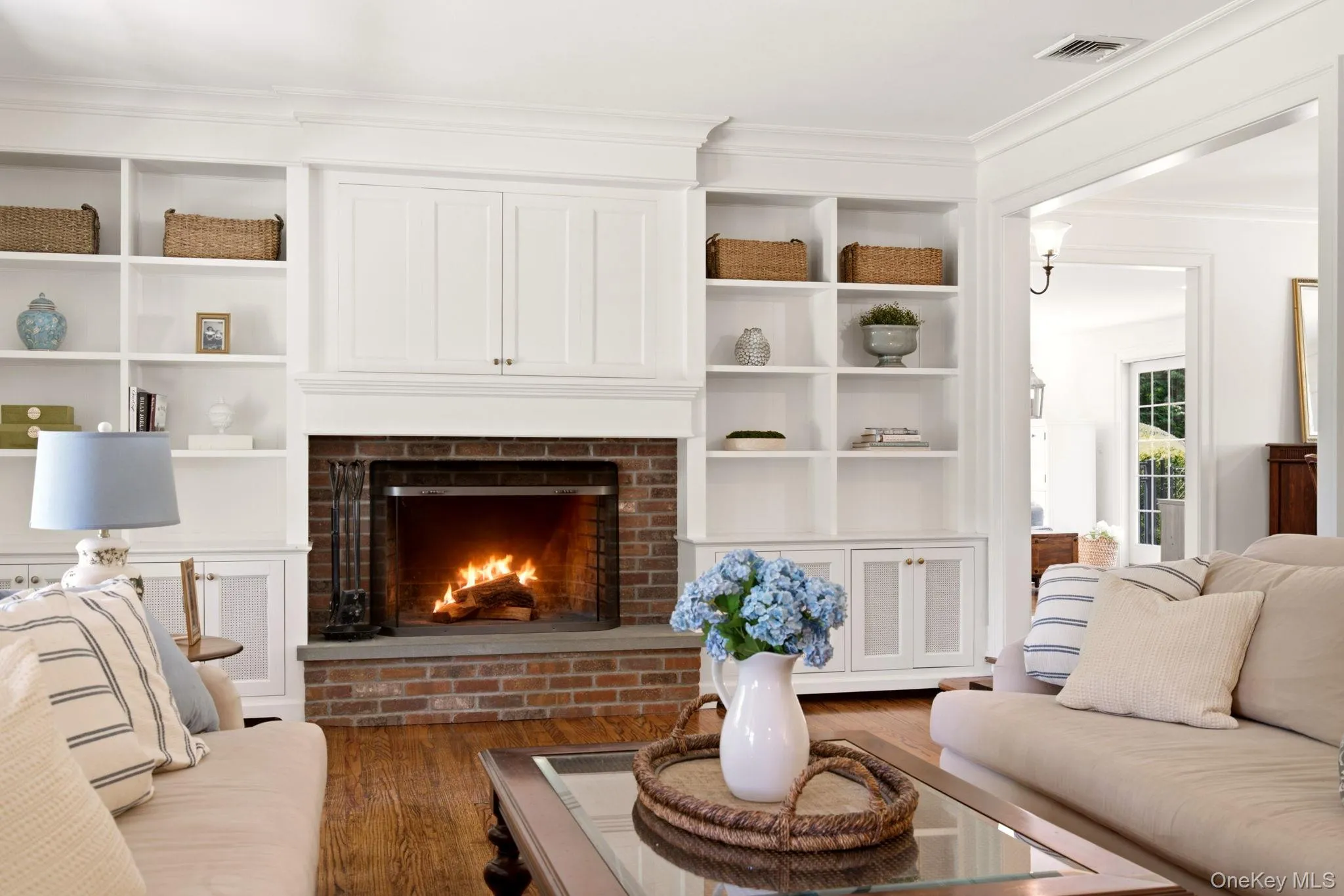 Wood buring fireplace and custom built-in cabinetry are the rooms focal point. Wood buring fireplace and custom built-in cabinetry are the rooms focal point.