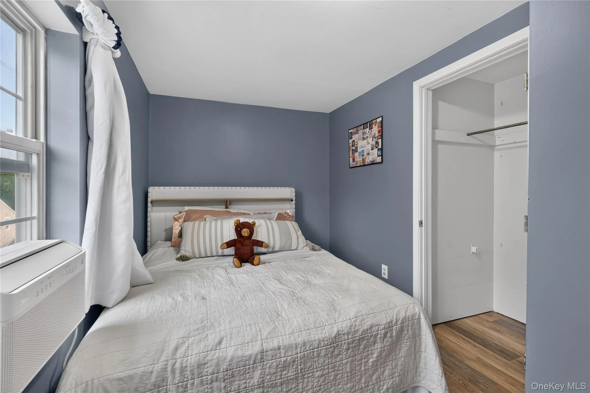Wood-finish flooring with a light blue wall finish Wood-finish flooring with a light blue wall finish