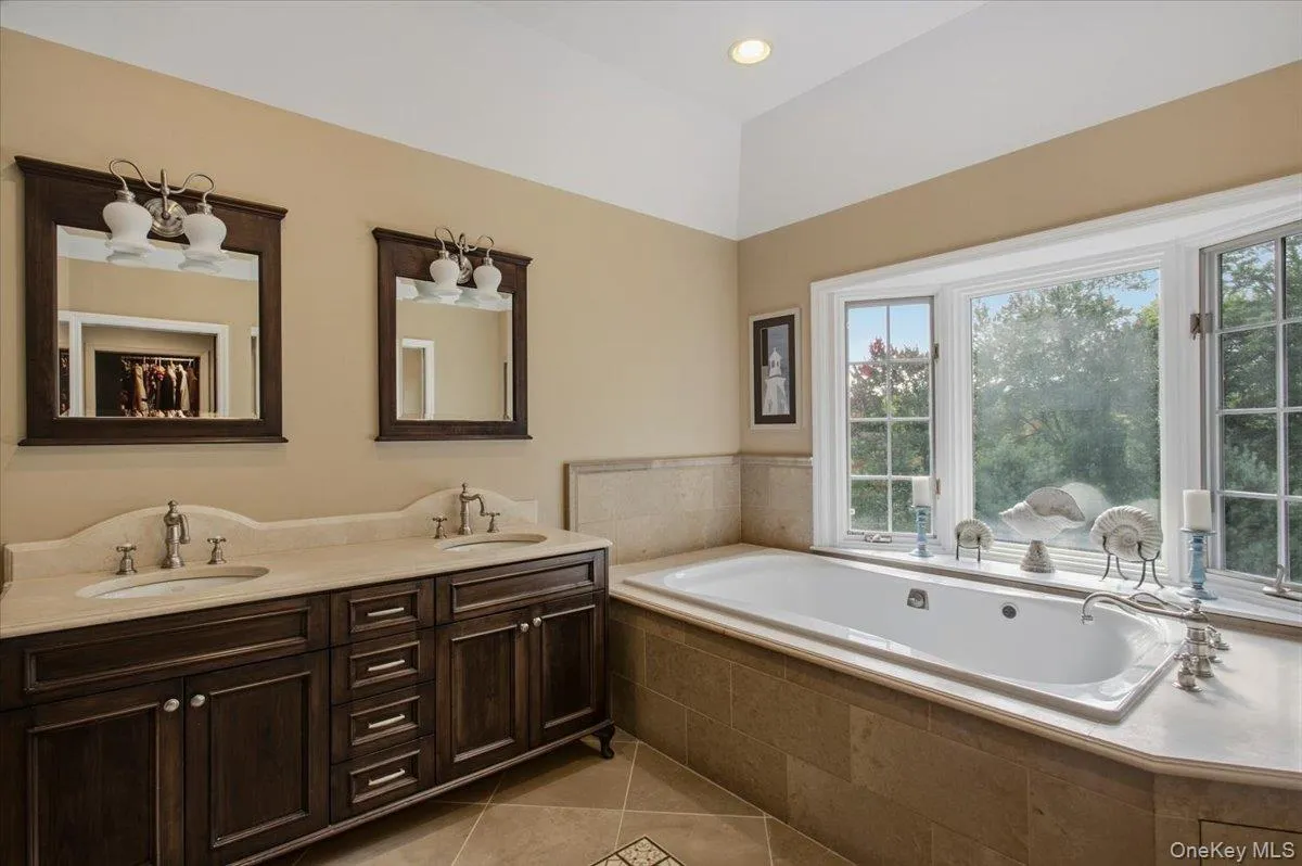 Master Bath showing double vanity and whirlpool tub Master Bath showing double vanity and whirlpool tub