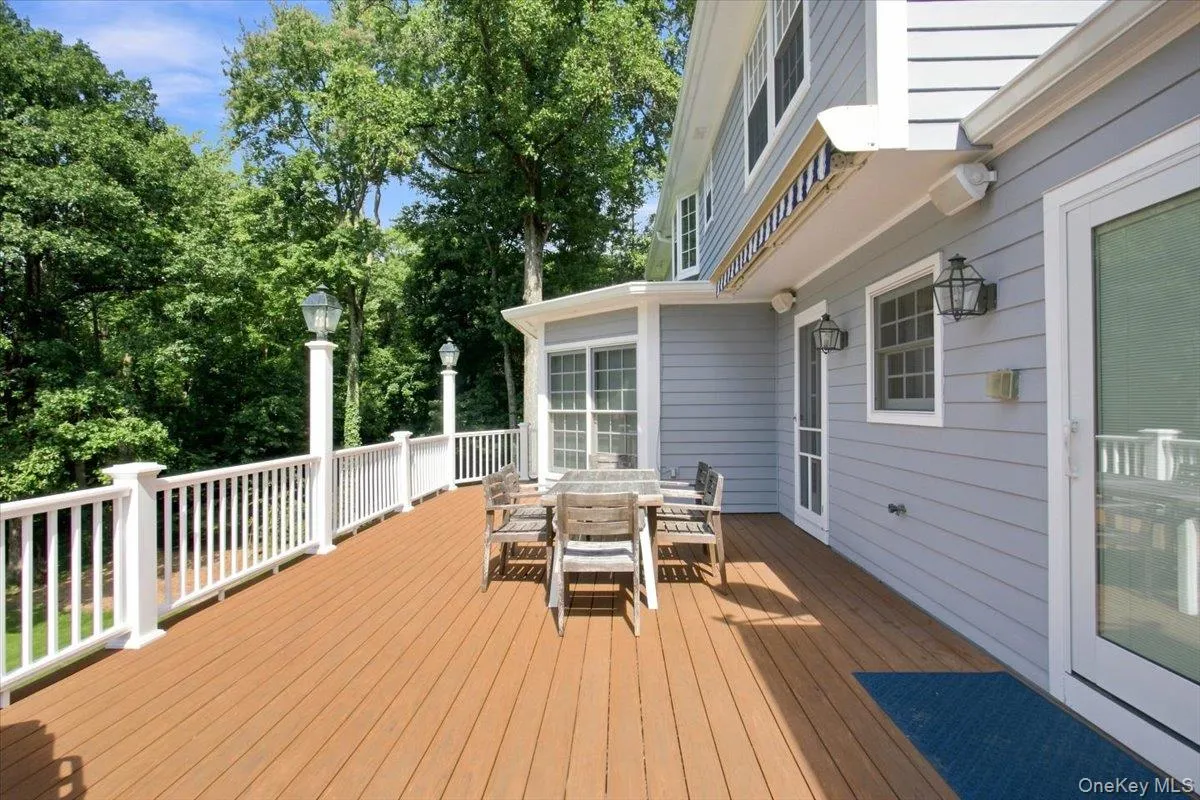 Deck off first floor with sliding glass doors to Kitchen Deck off first floor with sliding glass doors to Kitchen
