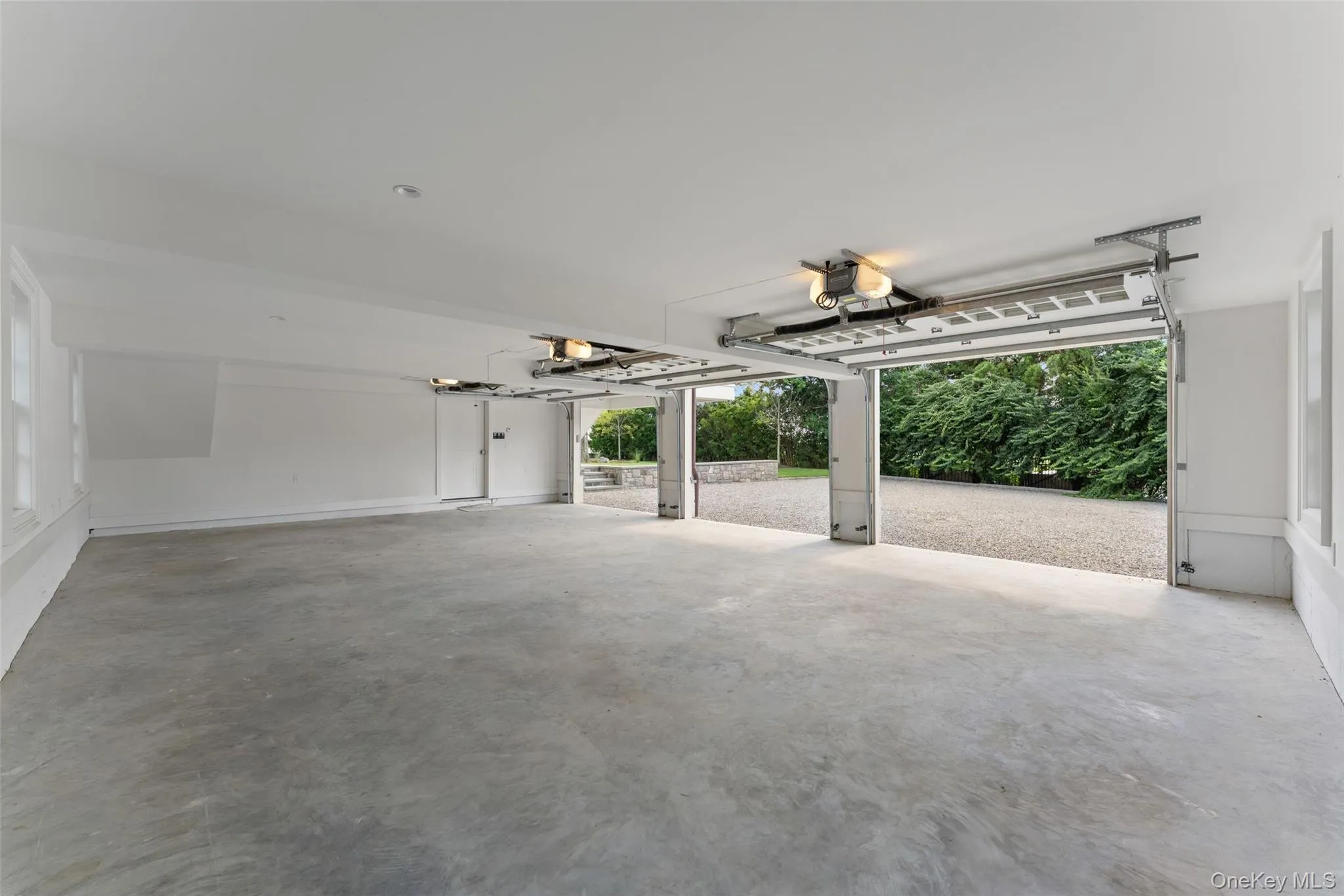 Heated and cooled three-car garage with bright, clean finishes and exceptional functionality. Heated and cooled three-car garage with bright, clean finishes and exceptional functionality.