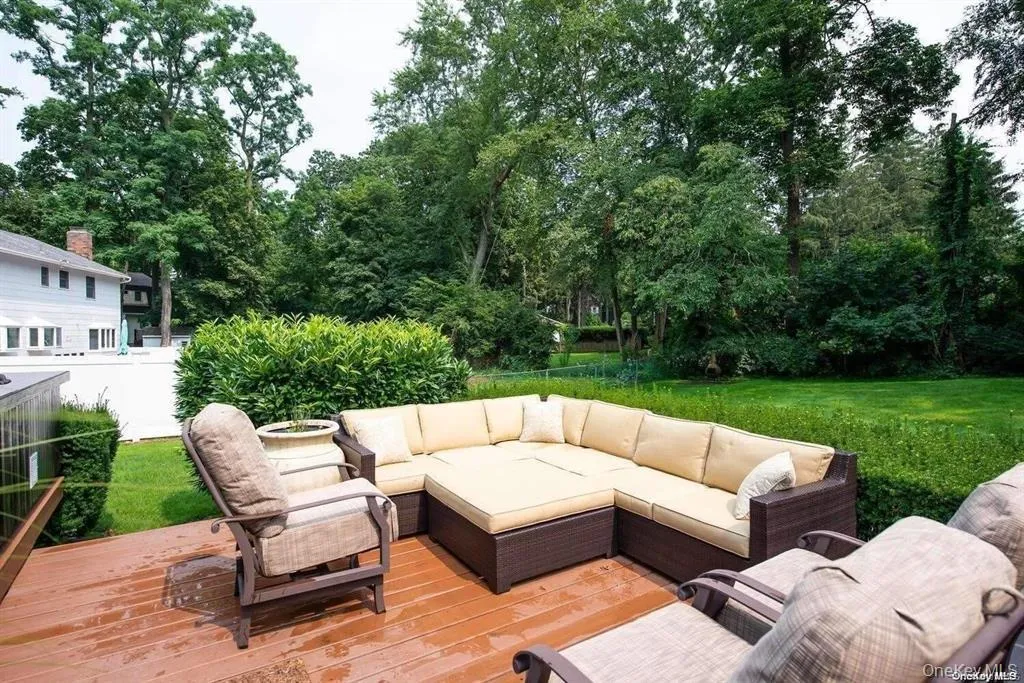 Deck with outdoor lounge area and a lawn Deck with outdoor lounge area and a lawn