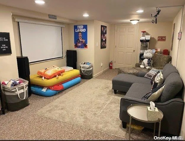 Carpeted cinema room with recessed lighting Carpeted cinema room with recessed lighting
