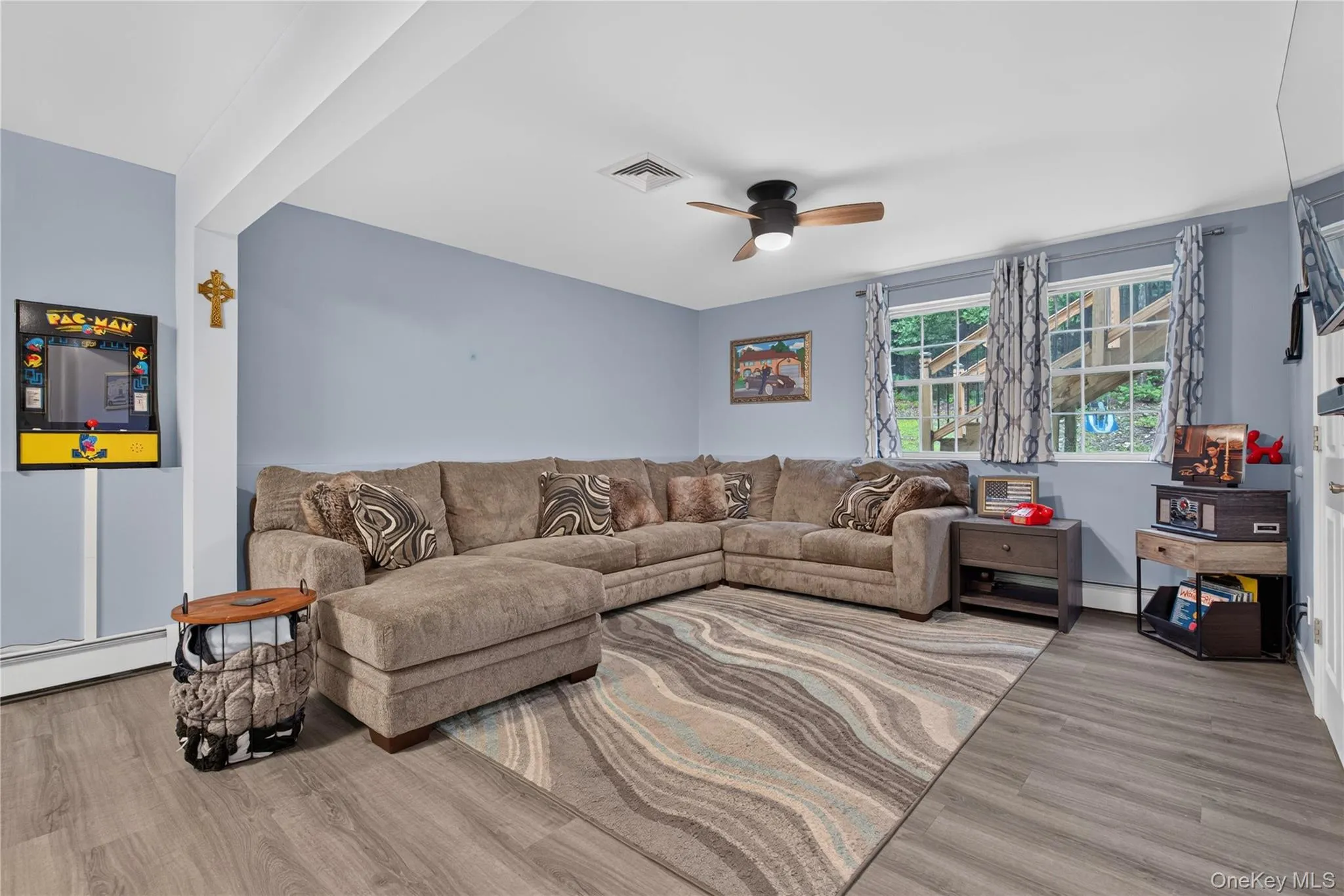 Recessed lighting, wood-finish flooring, and a ceiling fan with light fixture Recessed lighting, wood-finish flooring, and a ceiling fan with light fixture