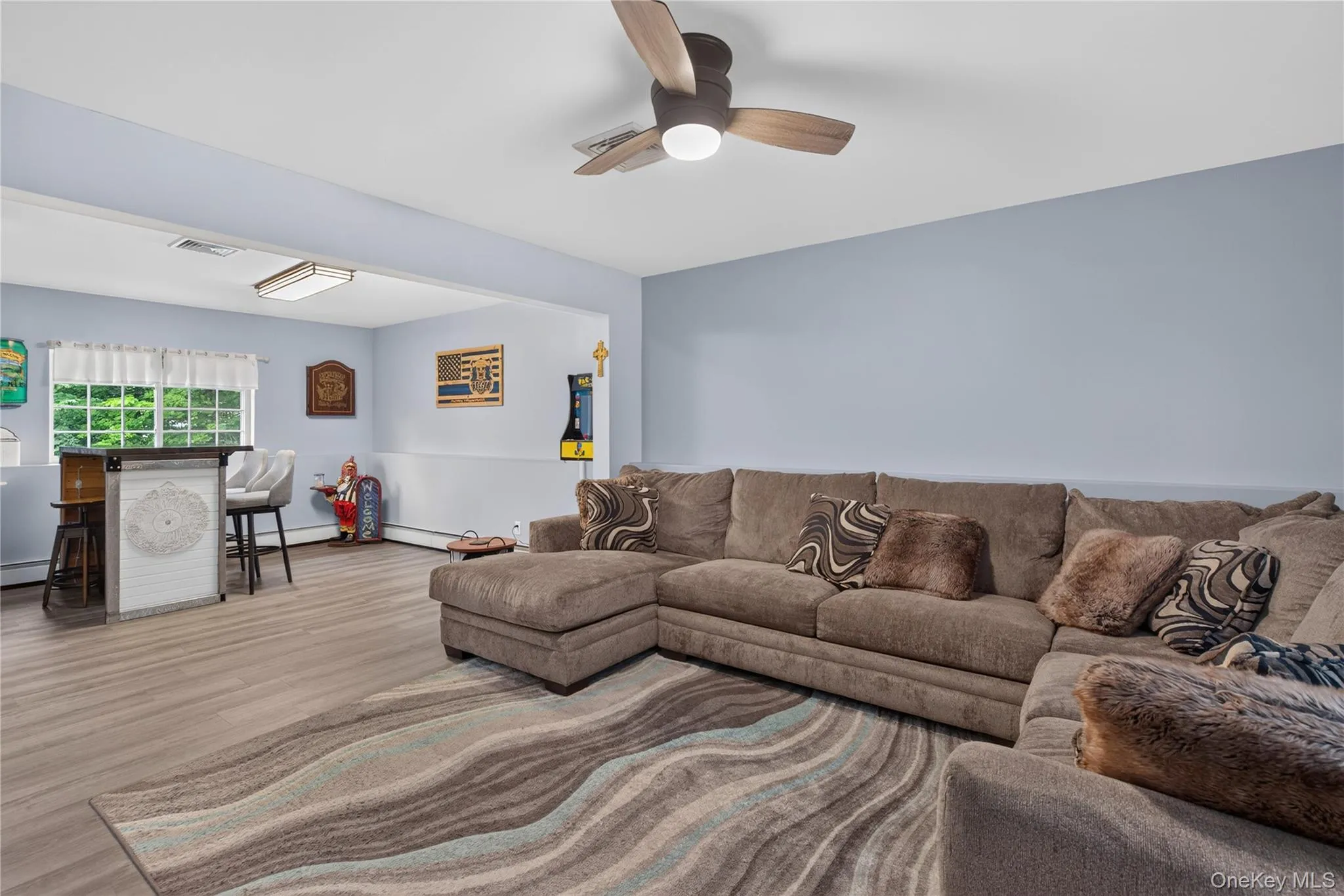 Wood-finish flooring throughout, complemented by a drop ceiling with recessed lighting Wood-finish flooring throughout, complemented by a drop ceiling with recessed lighting