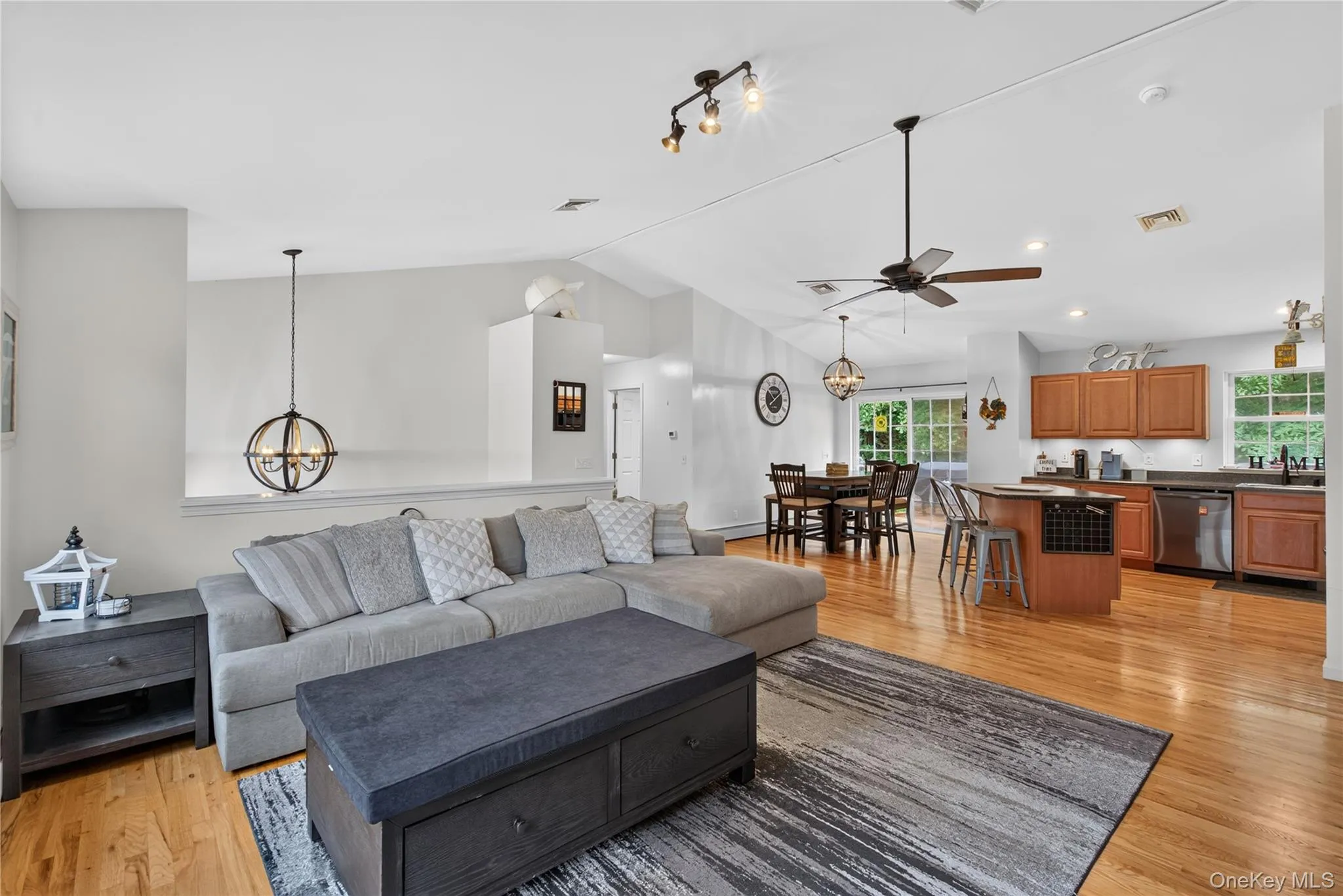 Vaulted ceilings, wood-finish flooring, recessed lighting, and an open-concept layout Vaulted ceilings, wood-finish flooring, recessed lighting, and an open-concept layout
