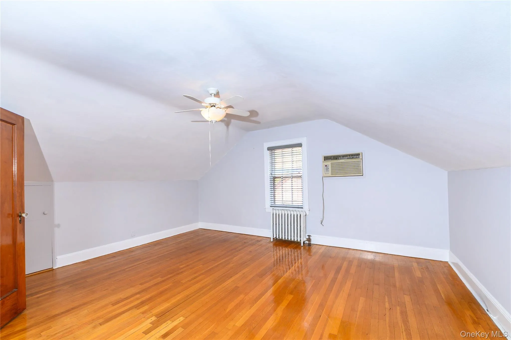Bonus Area-Wood-finish flooring with a ceiling fan, and air conditioning Bonus Area-Wood-finish flooring with a ceiling fan, and air conditioning