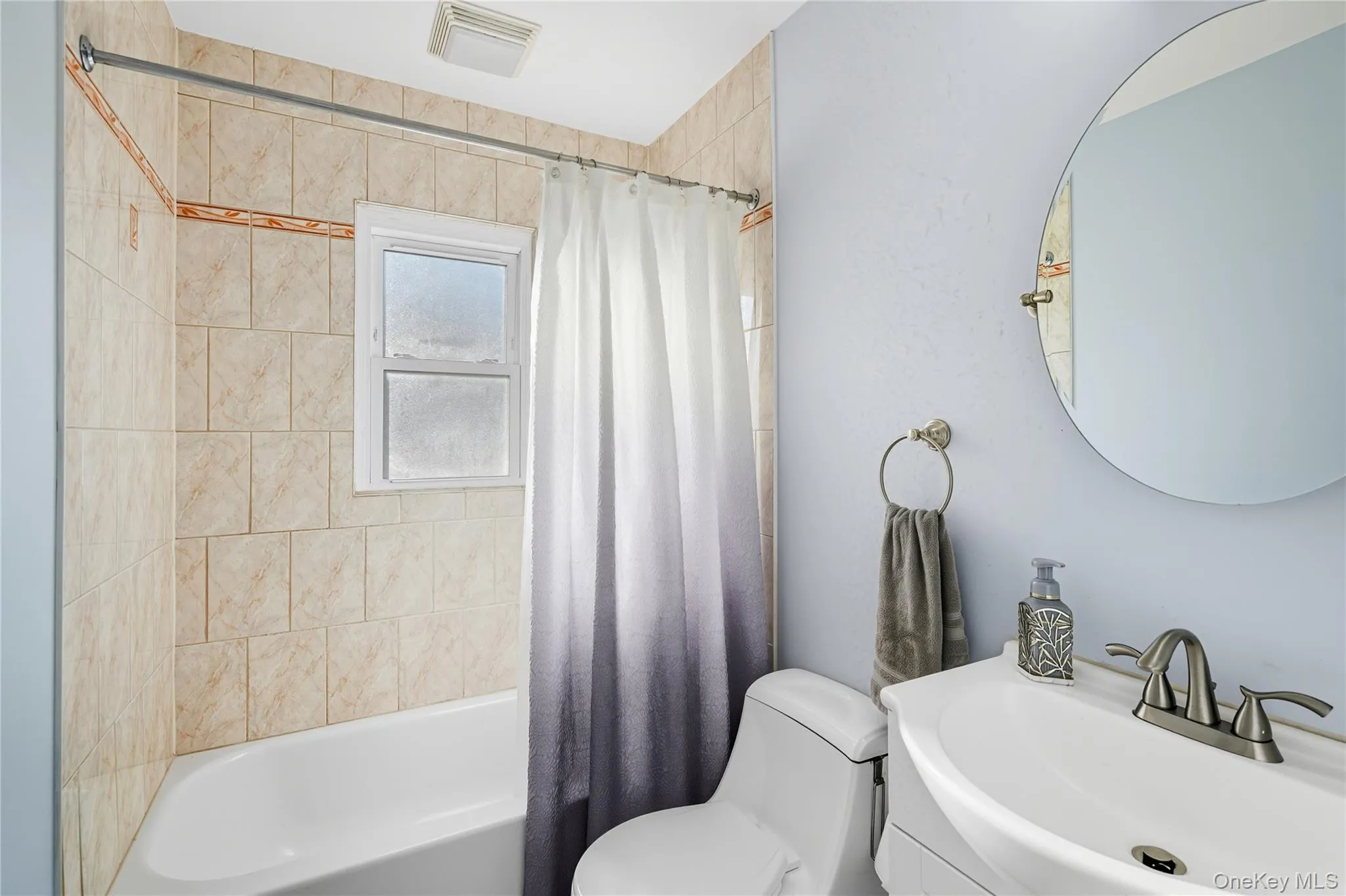 Bathroom with shower / bath combo and vanity Bathroom with shower / bath combo and vanity