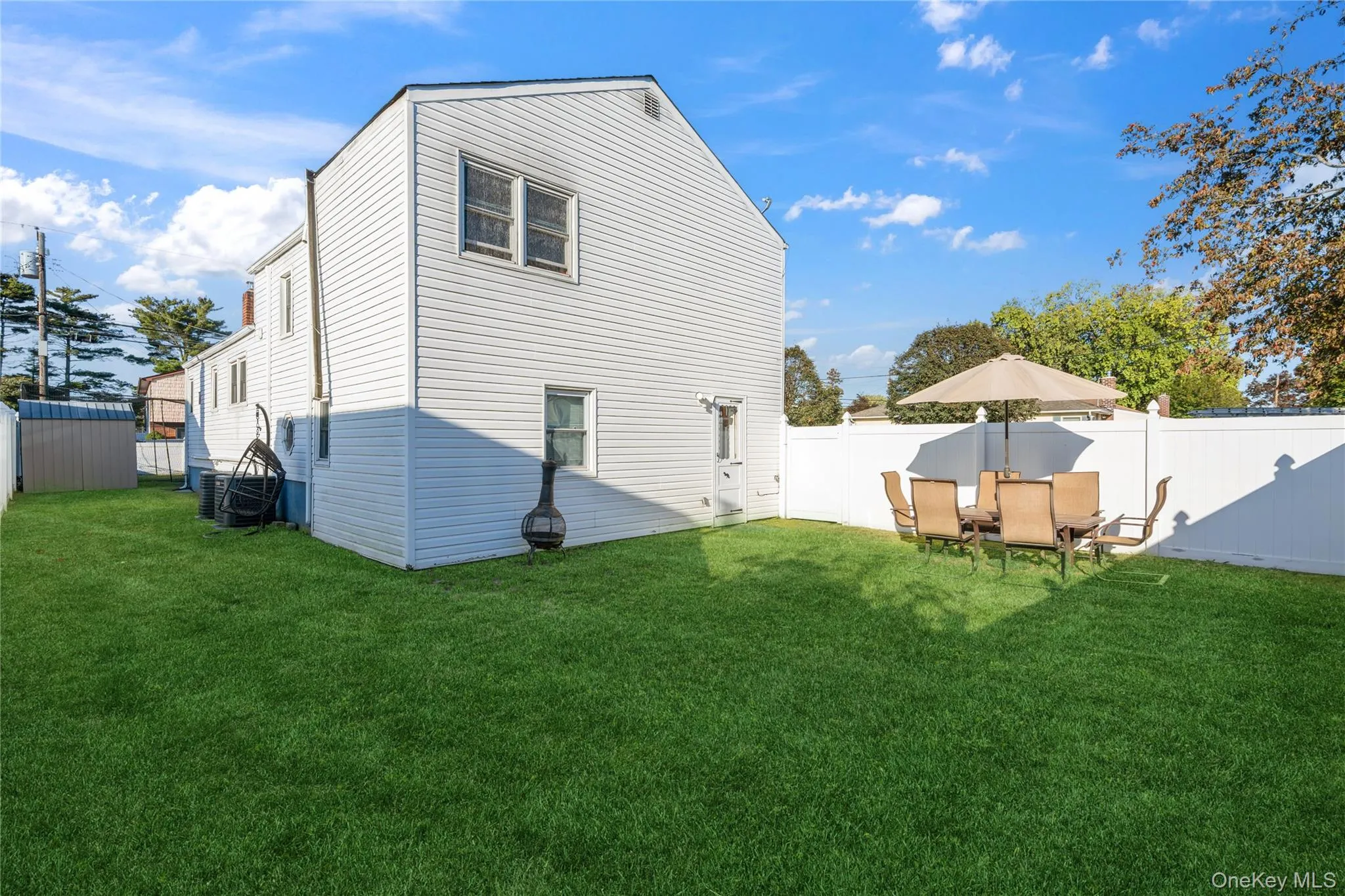 Rear view of house featuring a fenced backyard Rear view of house featuring a fenced backyard