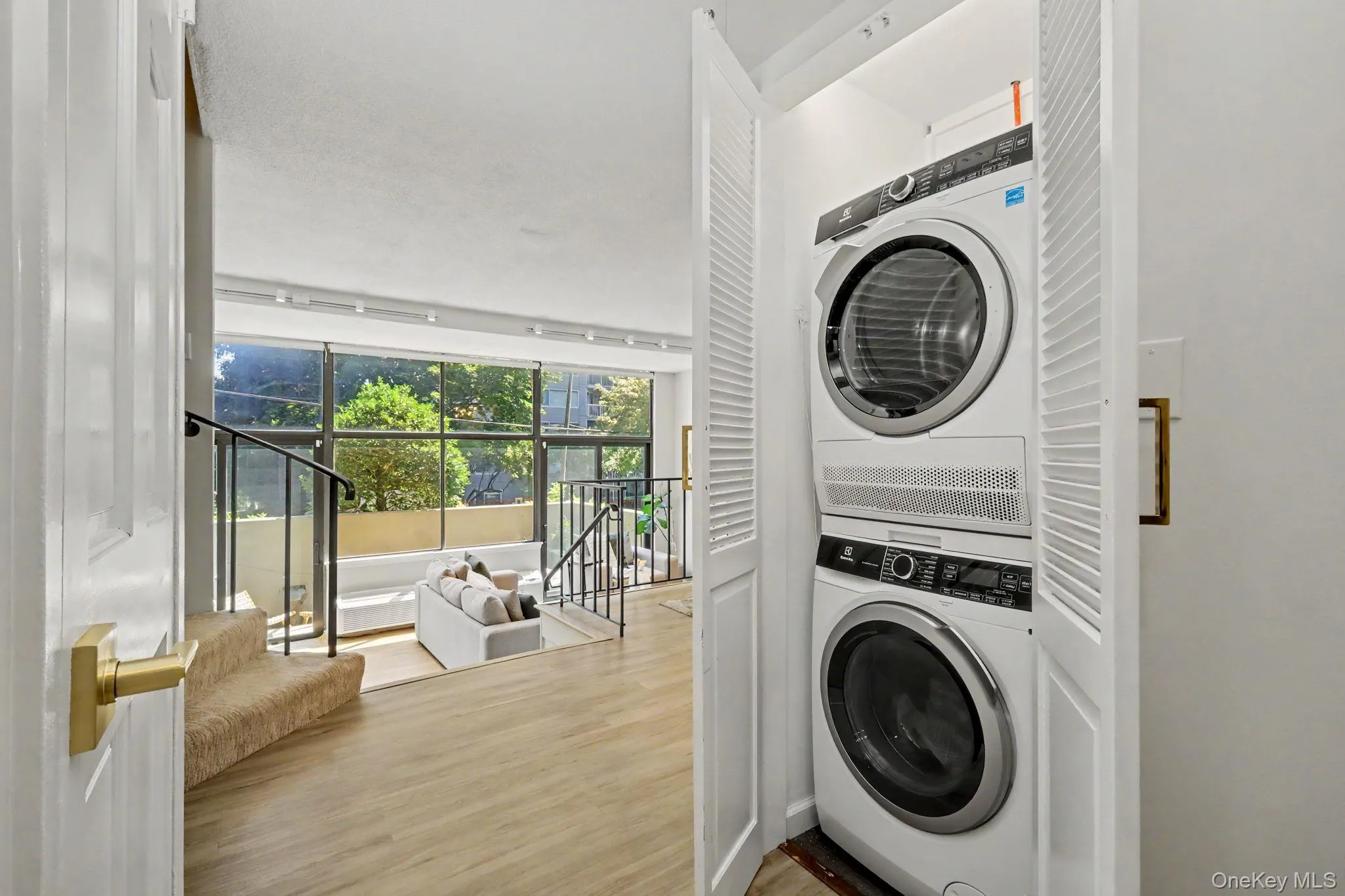 A conveniently located laundry closet off the foyer provides the ease and practicality of in-unit laundry while remaining discreetly tucked away. A conveniently located laundry closet off the foyer provides the ease and practicality of in-unit laundry while remaining discreetly tucked away.