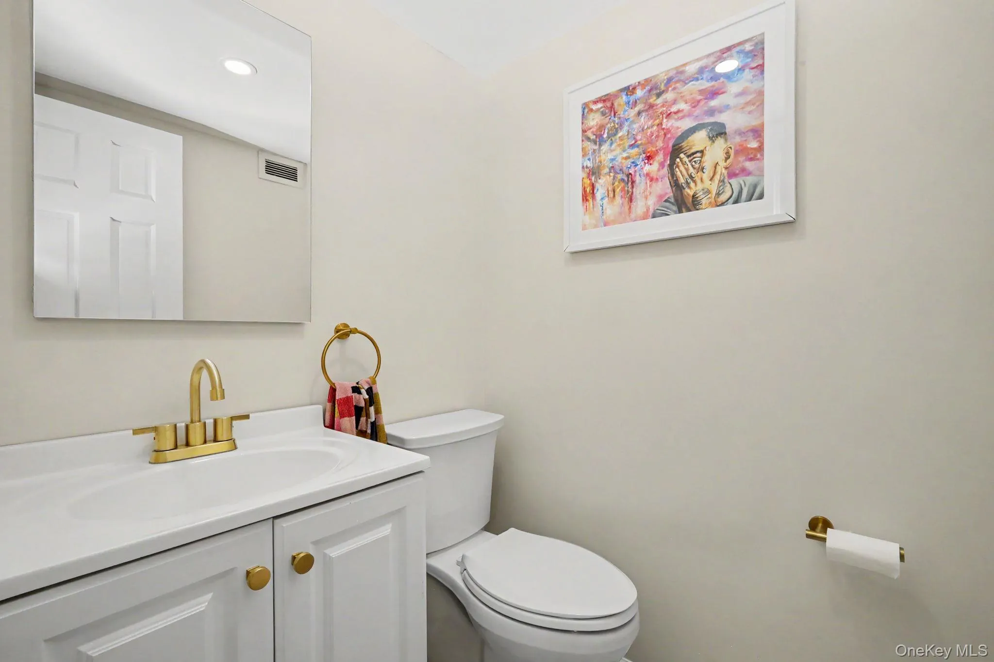 A beautifully renovated powder room adds a sophisticated touch to the main level, featuring stylish finishes, decorative lighting, and an elegant statement mirror. A beautifully renovated powder room adds a sophisticated touch to the main level, featuring stylish finishes, decorative lighting, and an elegant statement mirror.