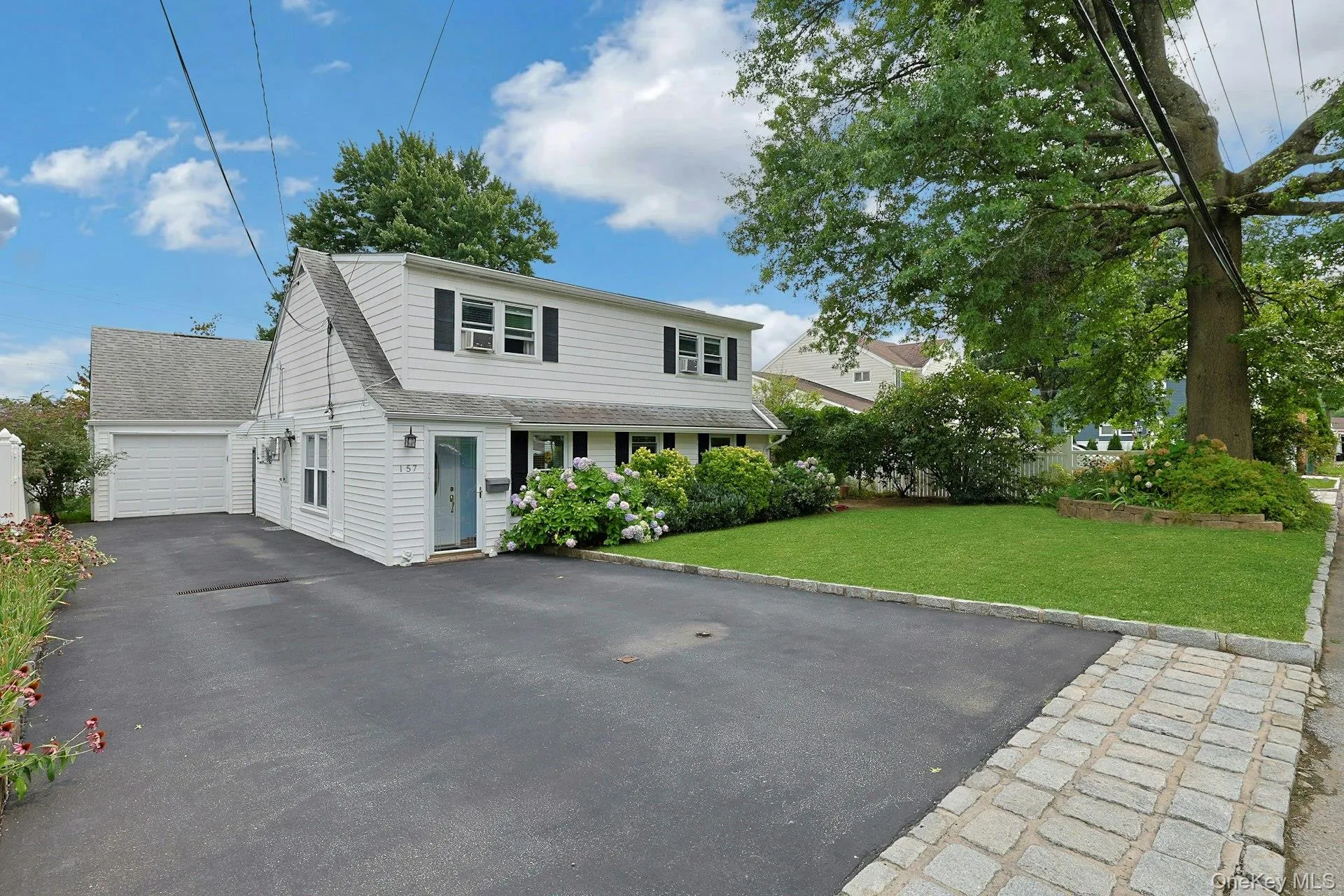 Front of Structure with driveway and garage Front of Structure with driveway and garage