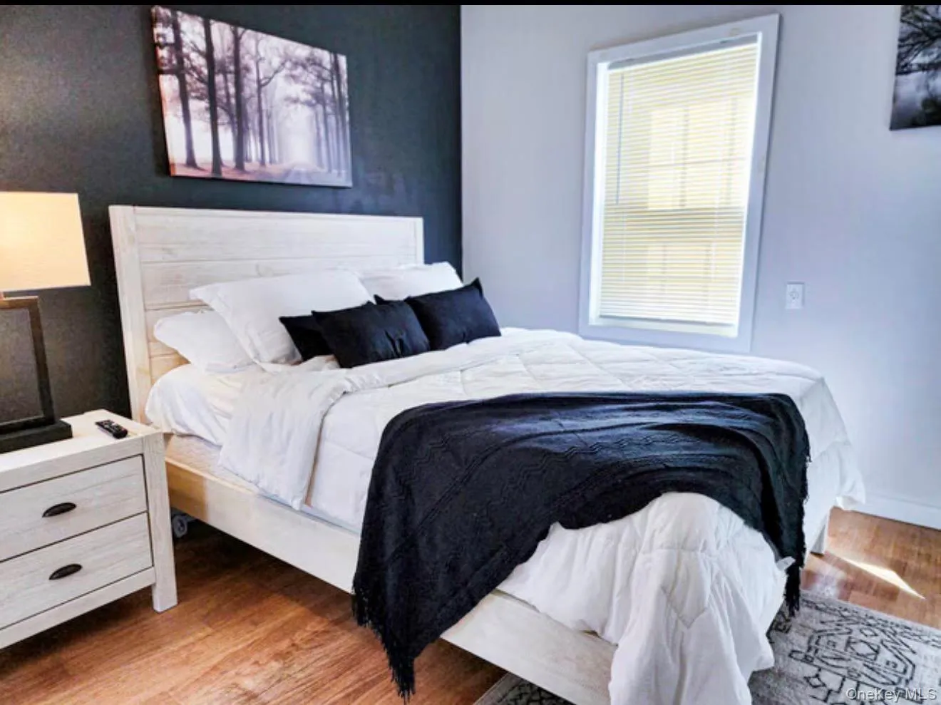 Master Bedroom with Wood-finish flooring with a contrasting accent wall, Full Bathroom and Closet. Master Bedroom with Wood-finish flooring with a contrasting accent wall, Full Bathroom and Closet.