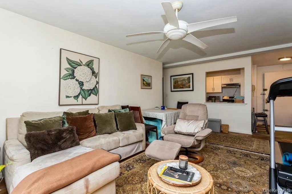Living area featuring ceiling fan Living area featuring ceiling fan